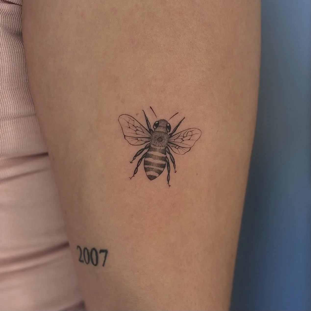 Fine line animal tattoo on the arm