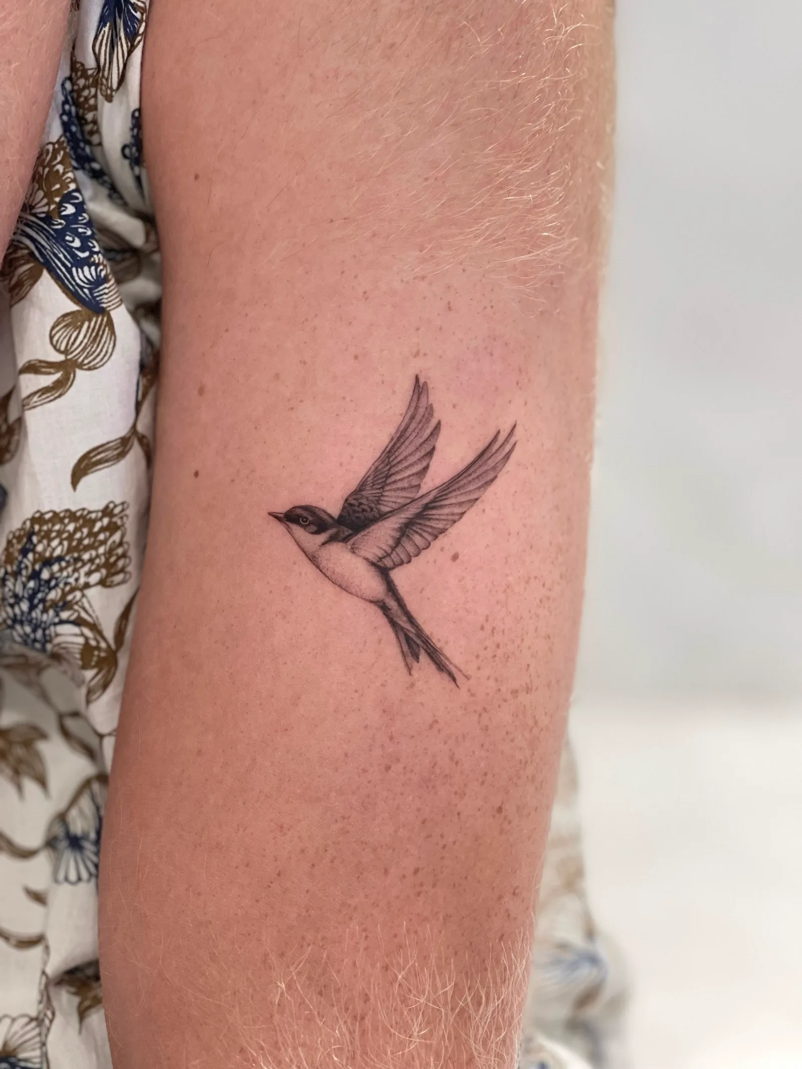 Fine line animal tattoo on the arm