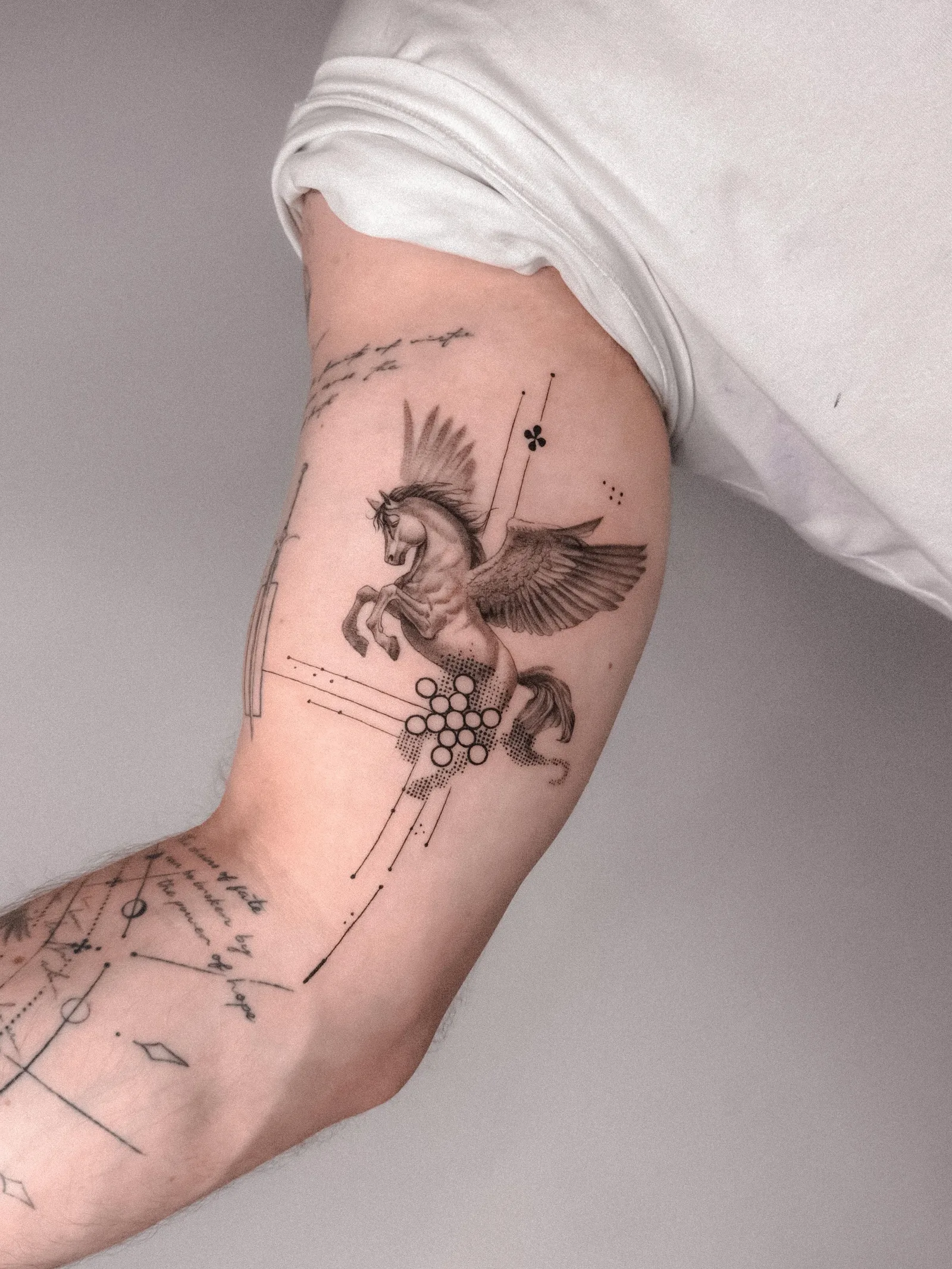Fine line abstract tattoo on the arm