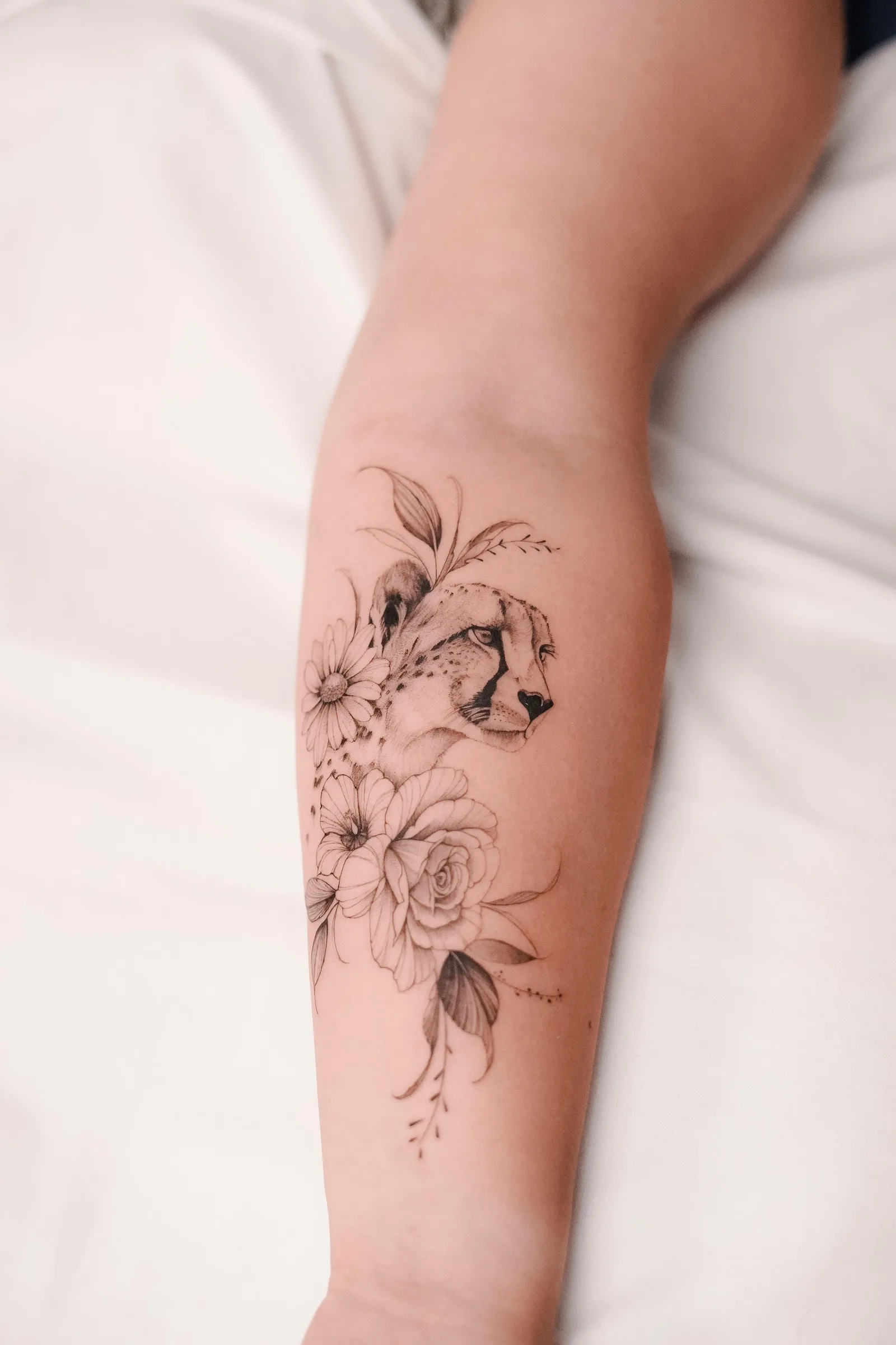 Fine line animal tattoo on the arm
