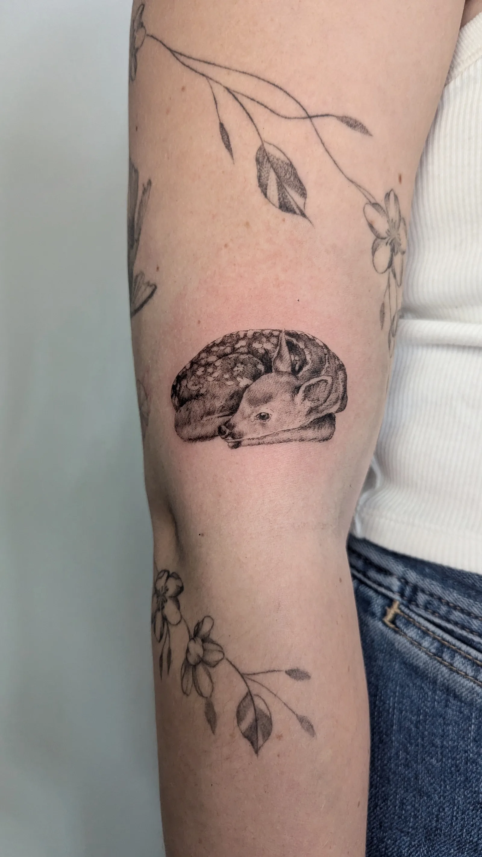 Fine line animal tattoo on the arm