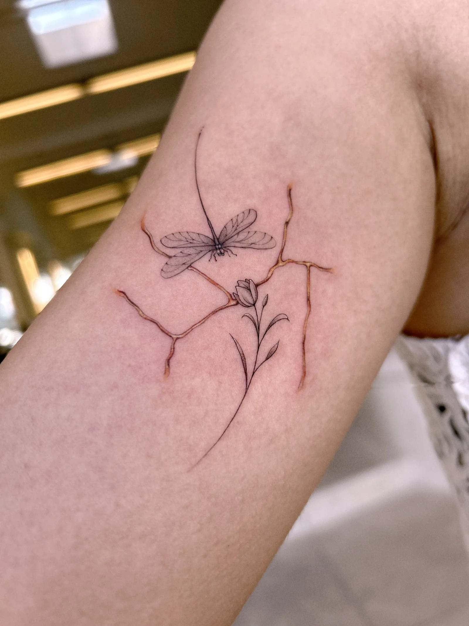 Fine line animal tattoo on the arm