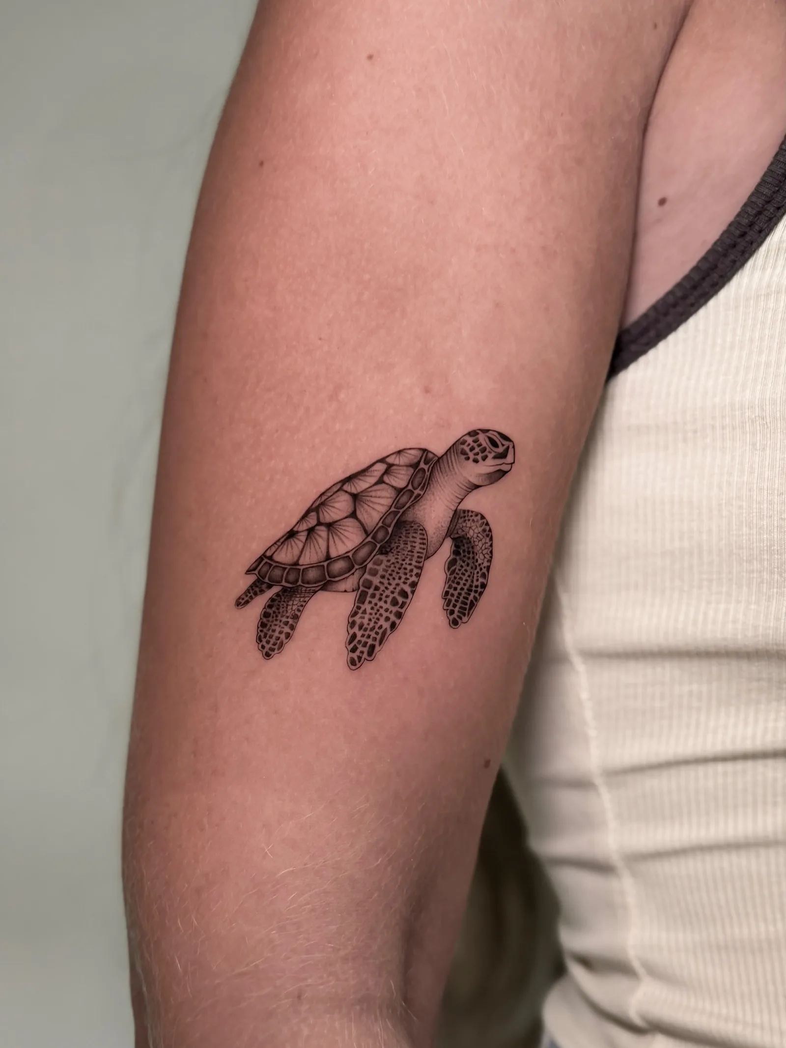 Fine line Balinese tattoo on the arm