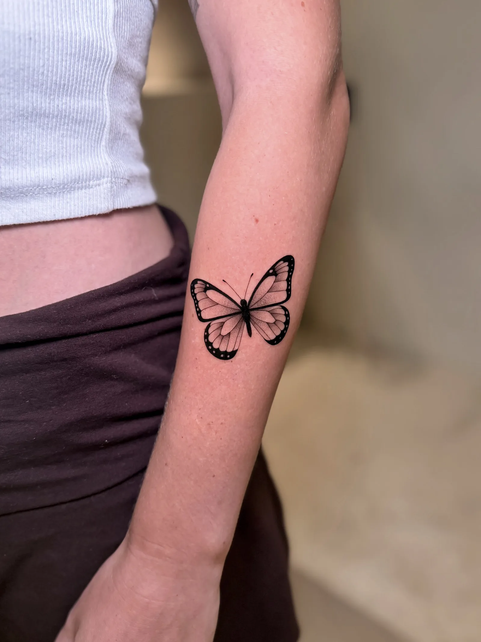 Fine line Balinese tattoo on the arm