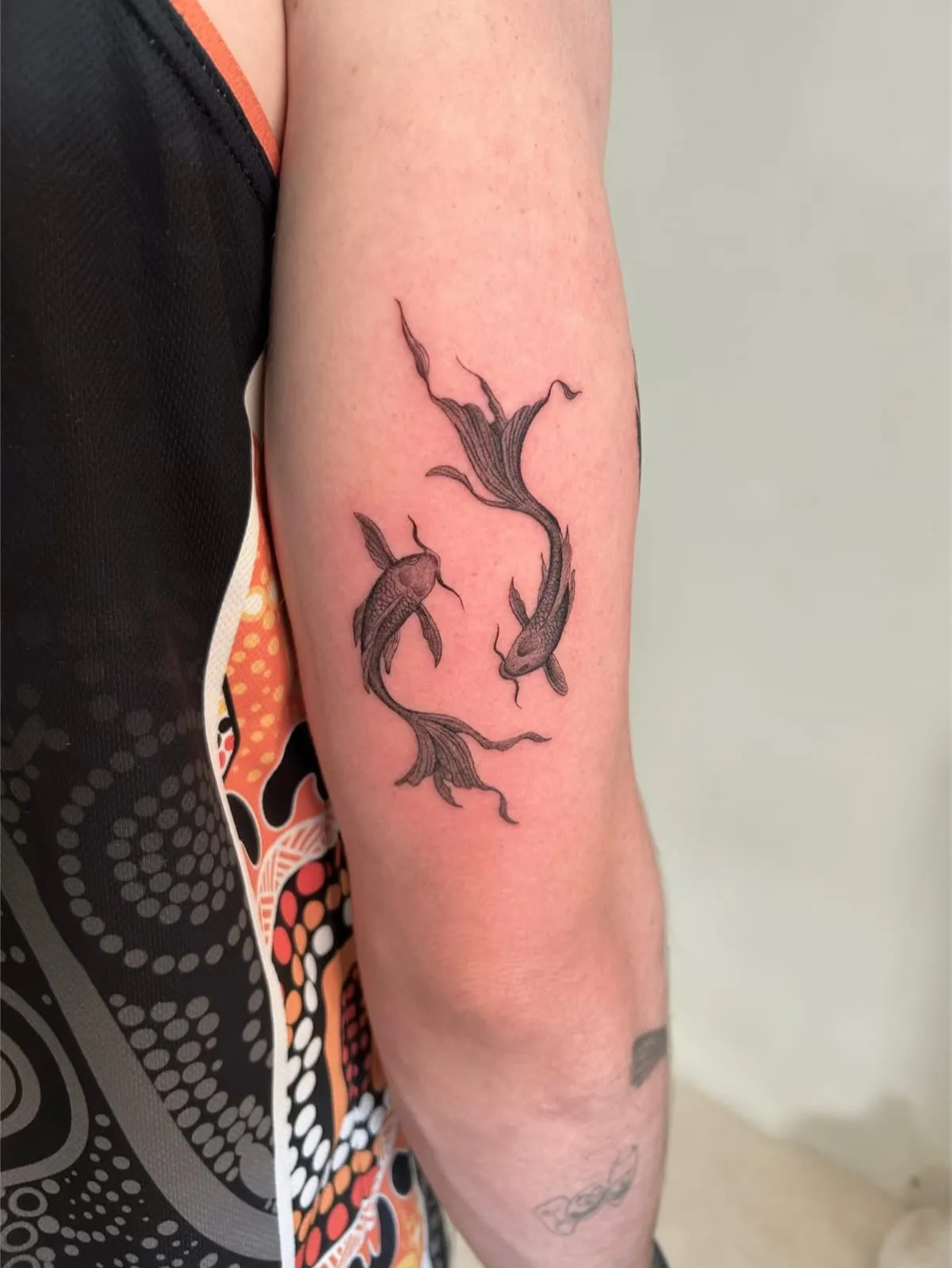 Fine line Balinese tattoo on the arm