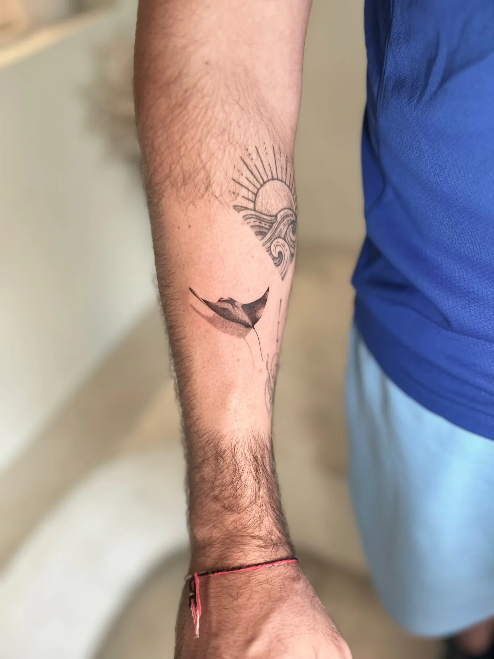 Fine line Balinese tattoo on the arm