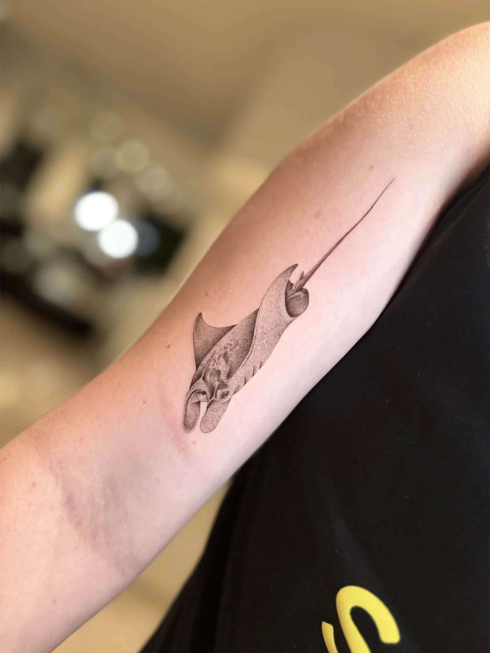 Fine line Balinese tattoo on the arm