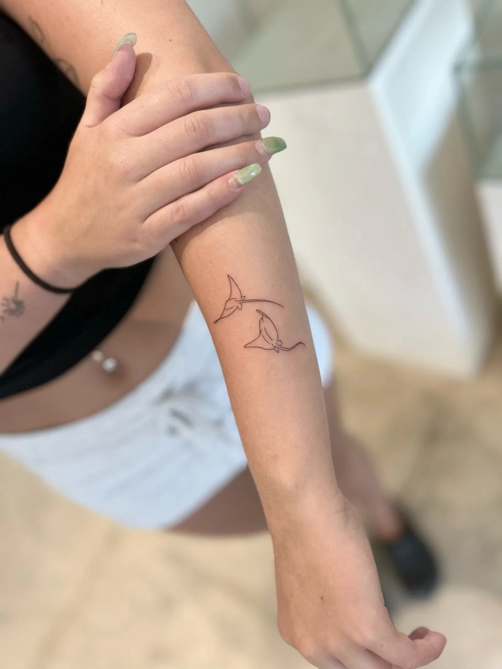 Fine line Balinese tattoo on the arm