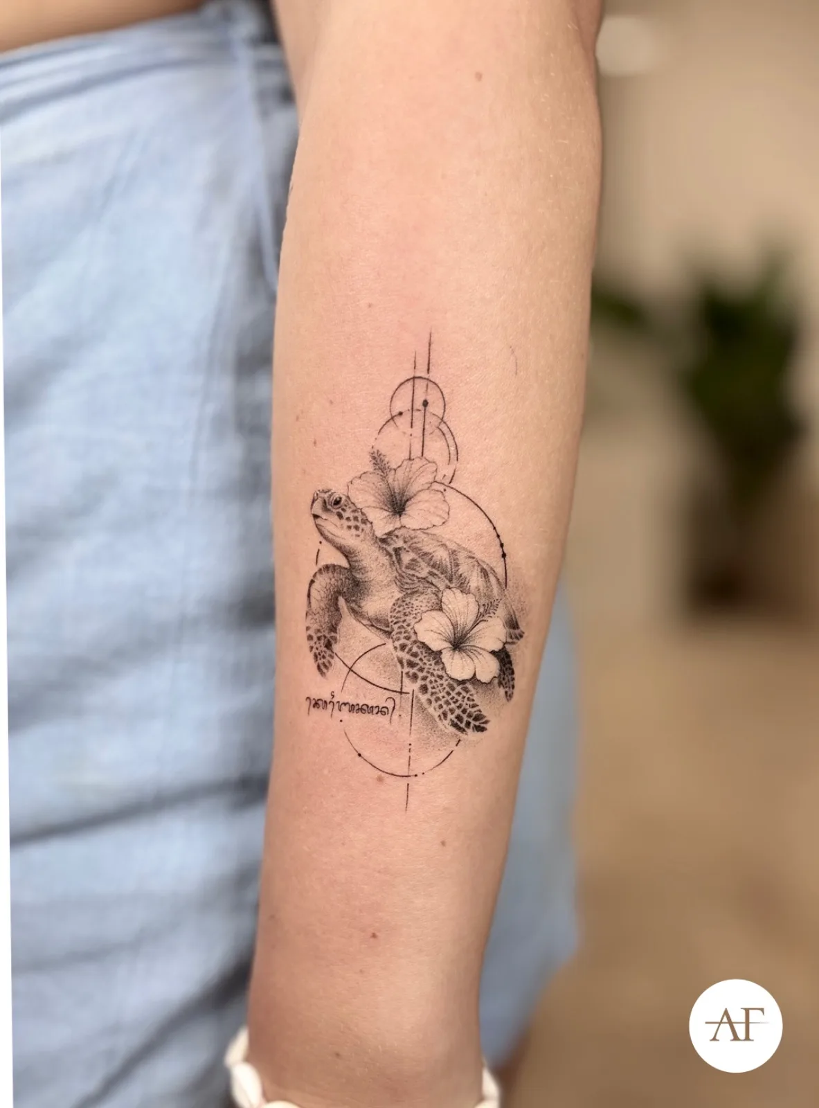 Fine line Balinese tattoo on the arm