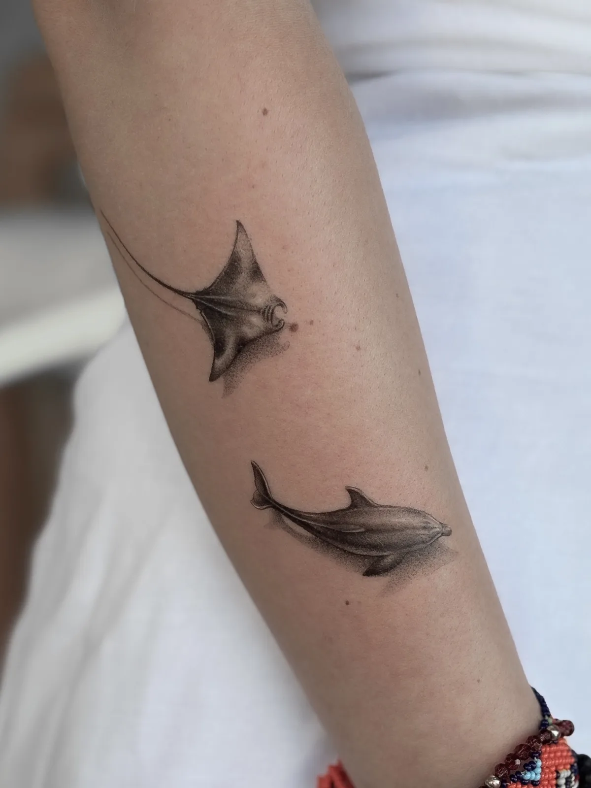 Fine line Balinese tattoo on the arm