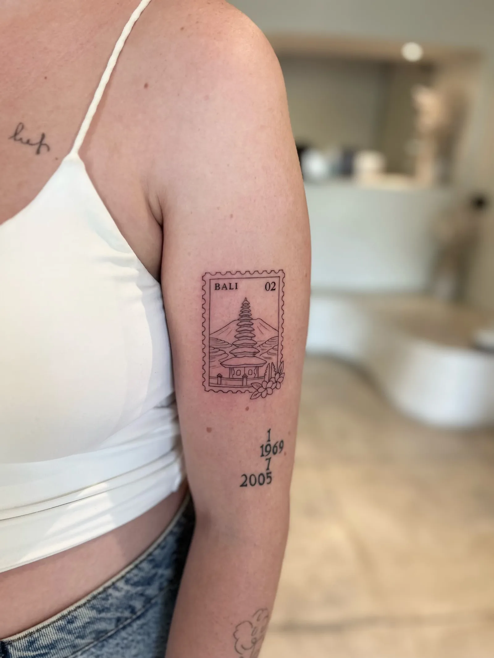 Blackwork & geometric Balinese tattoo on the arm