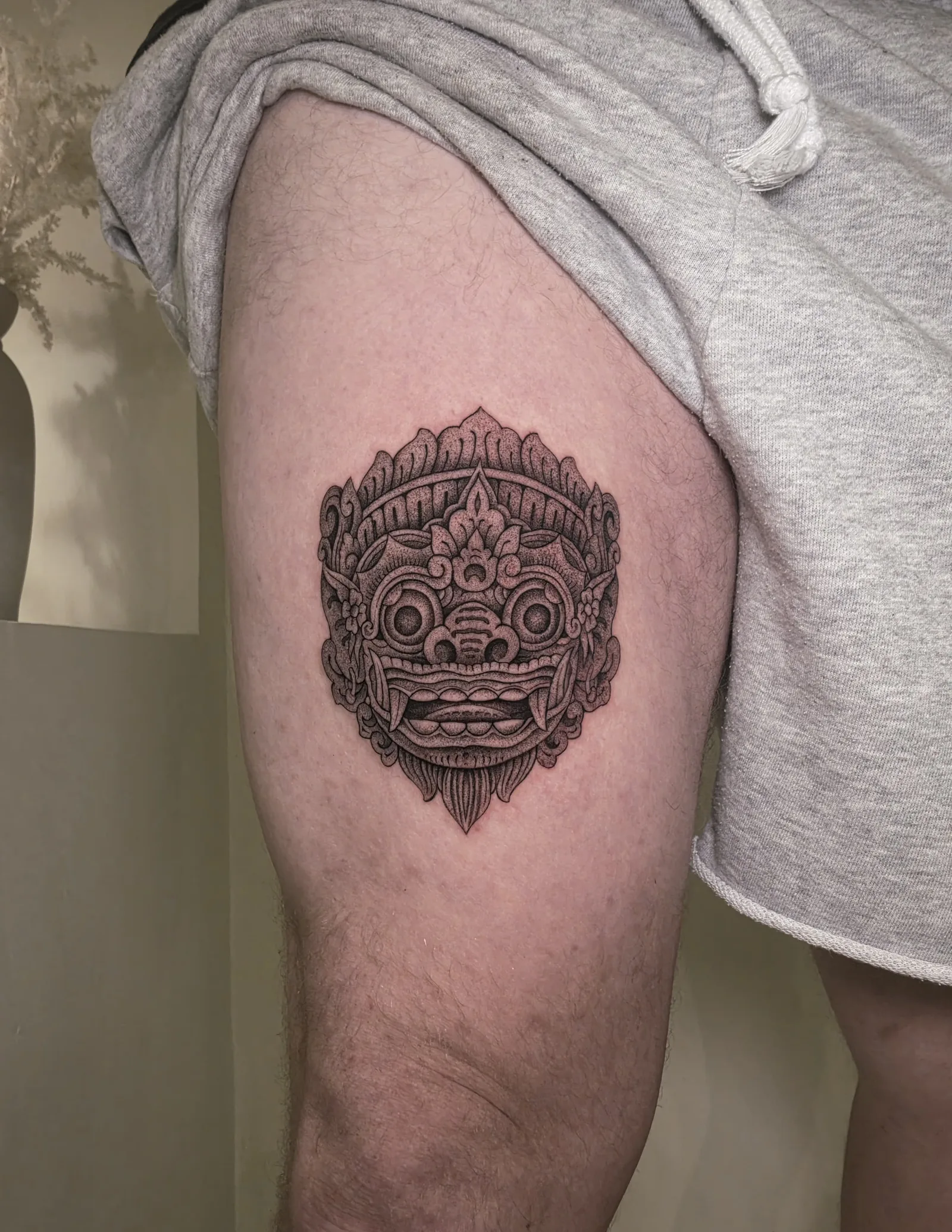 Blackwork & geometric Balinese tattoo on the arm