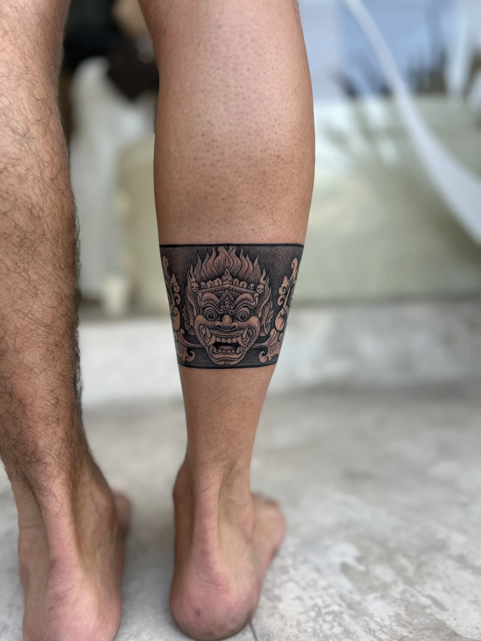 Blackwork & geometric Balinese tattoo on the arm