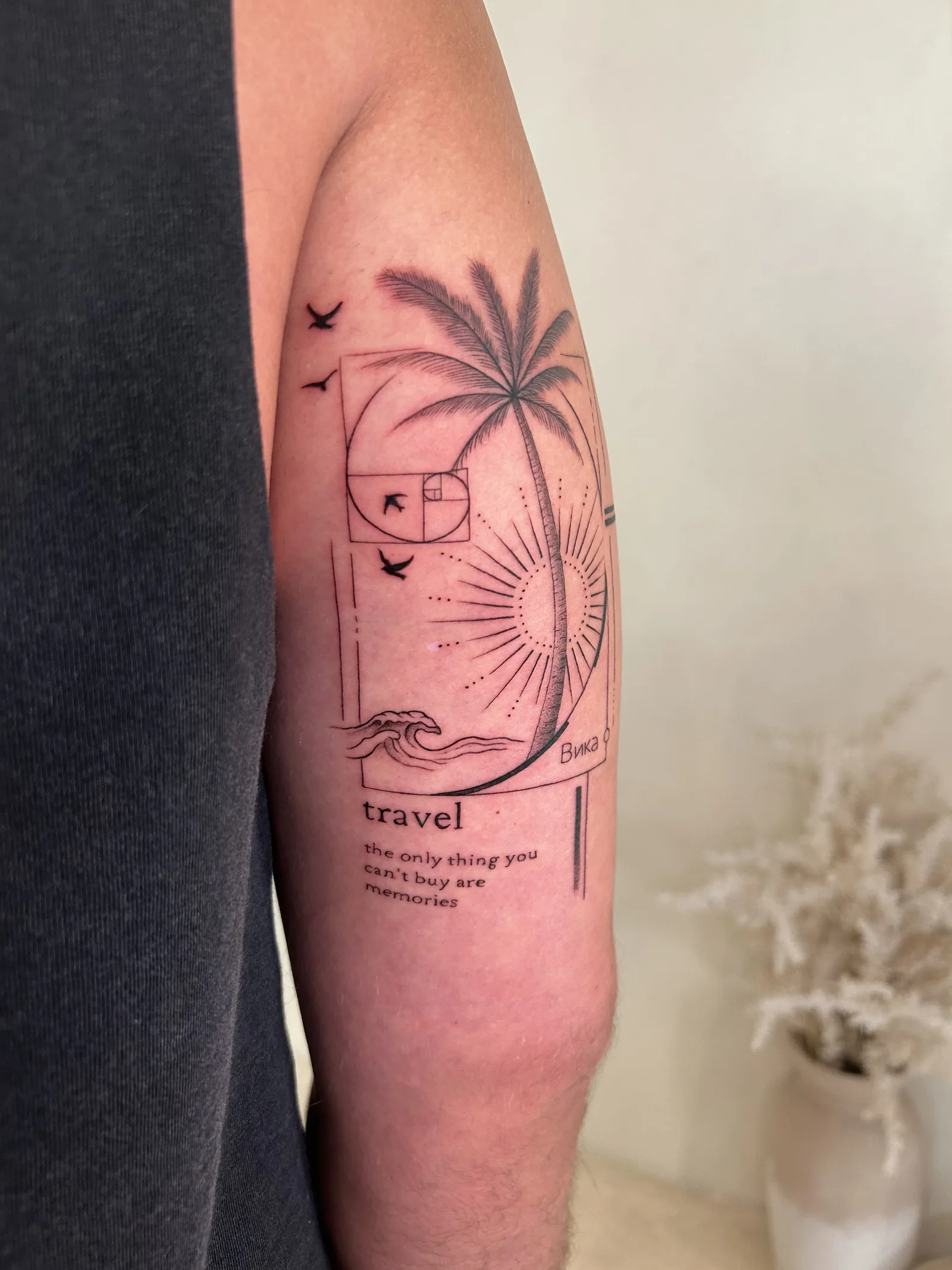 Blackwork & geometric Balinese tattoo on the arm