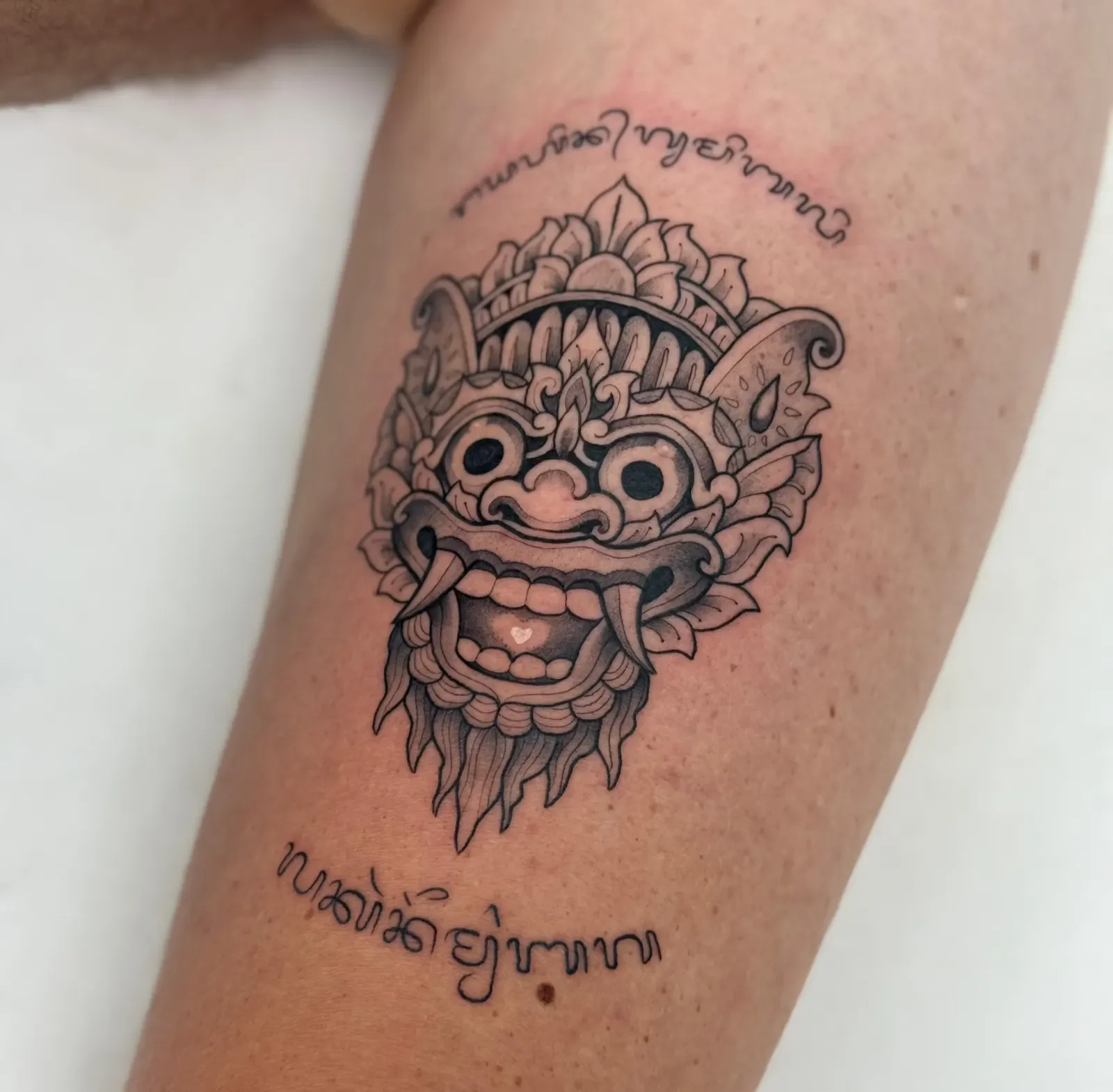 Blackwork & geometric Balinese tattoo on the leg