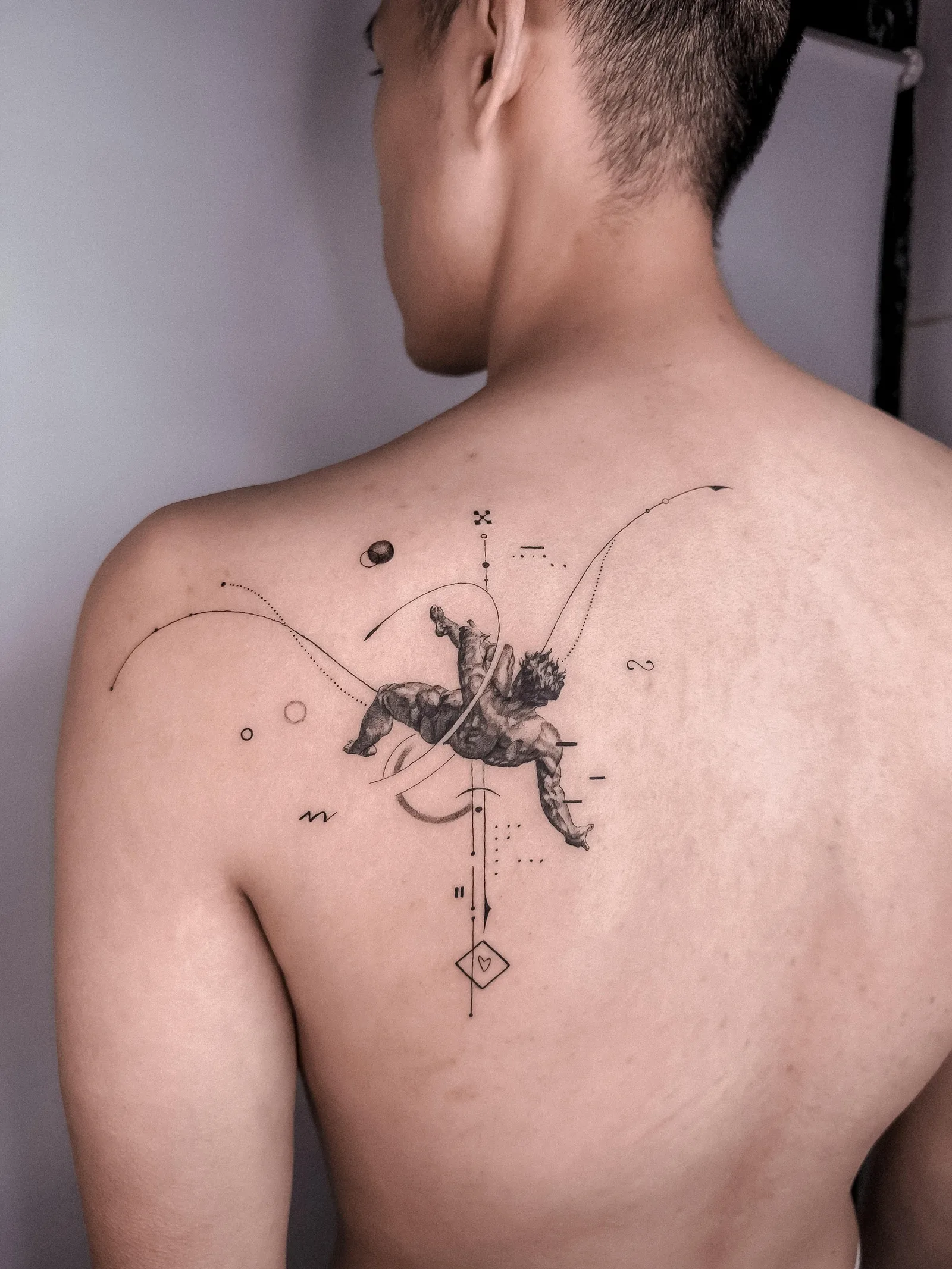 Fine line abstract tattoo on the arm