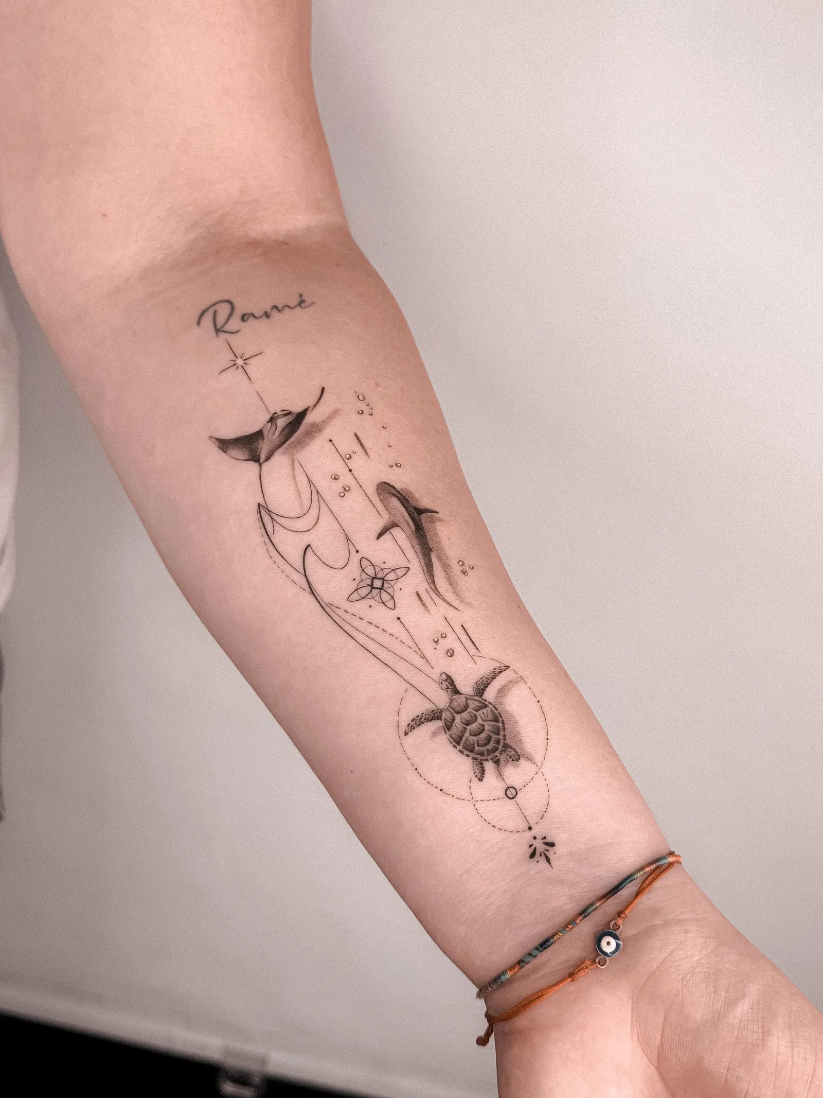 Fine line abstract tattoo on the arm