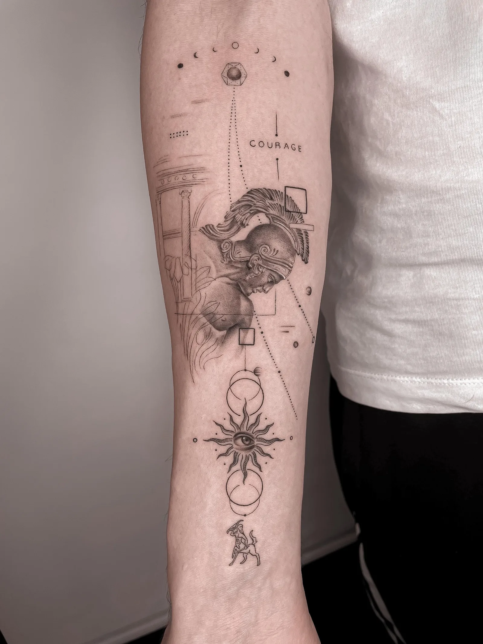 Fine line abstract tattoo on the arm