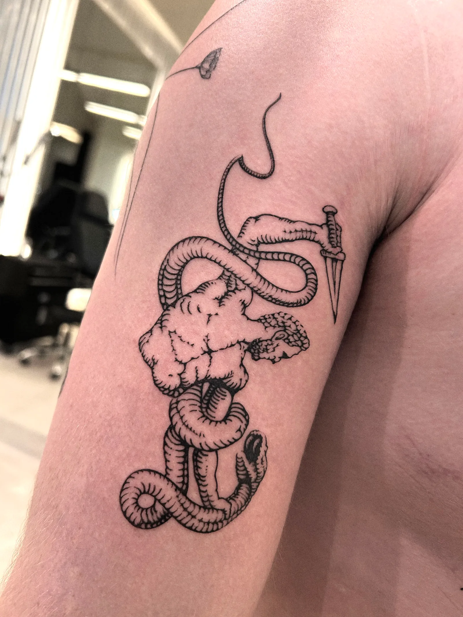 Fine line abstract tattoo on the arm