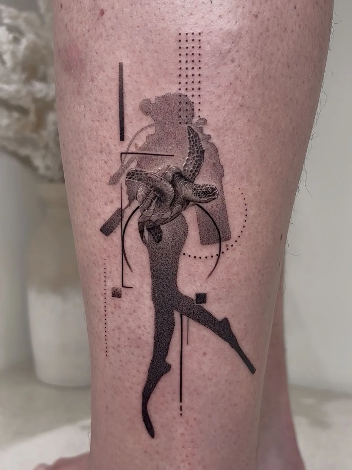 Fine line abstract tattoo on the arm