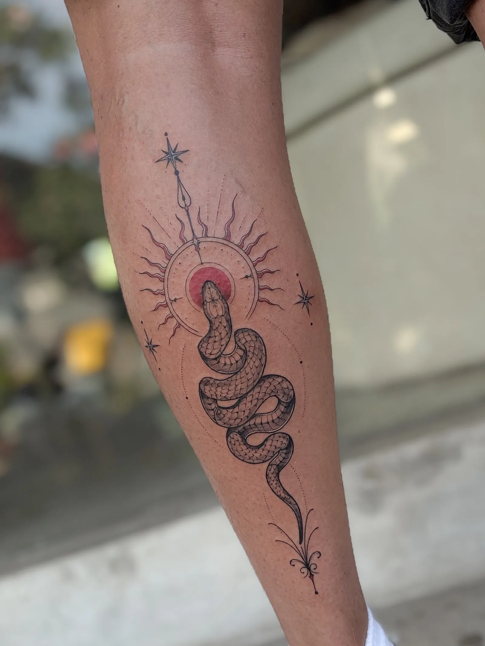 Fine line abstract tattoo on the arm