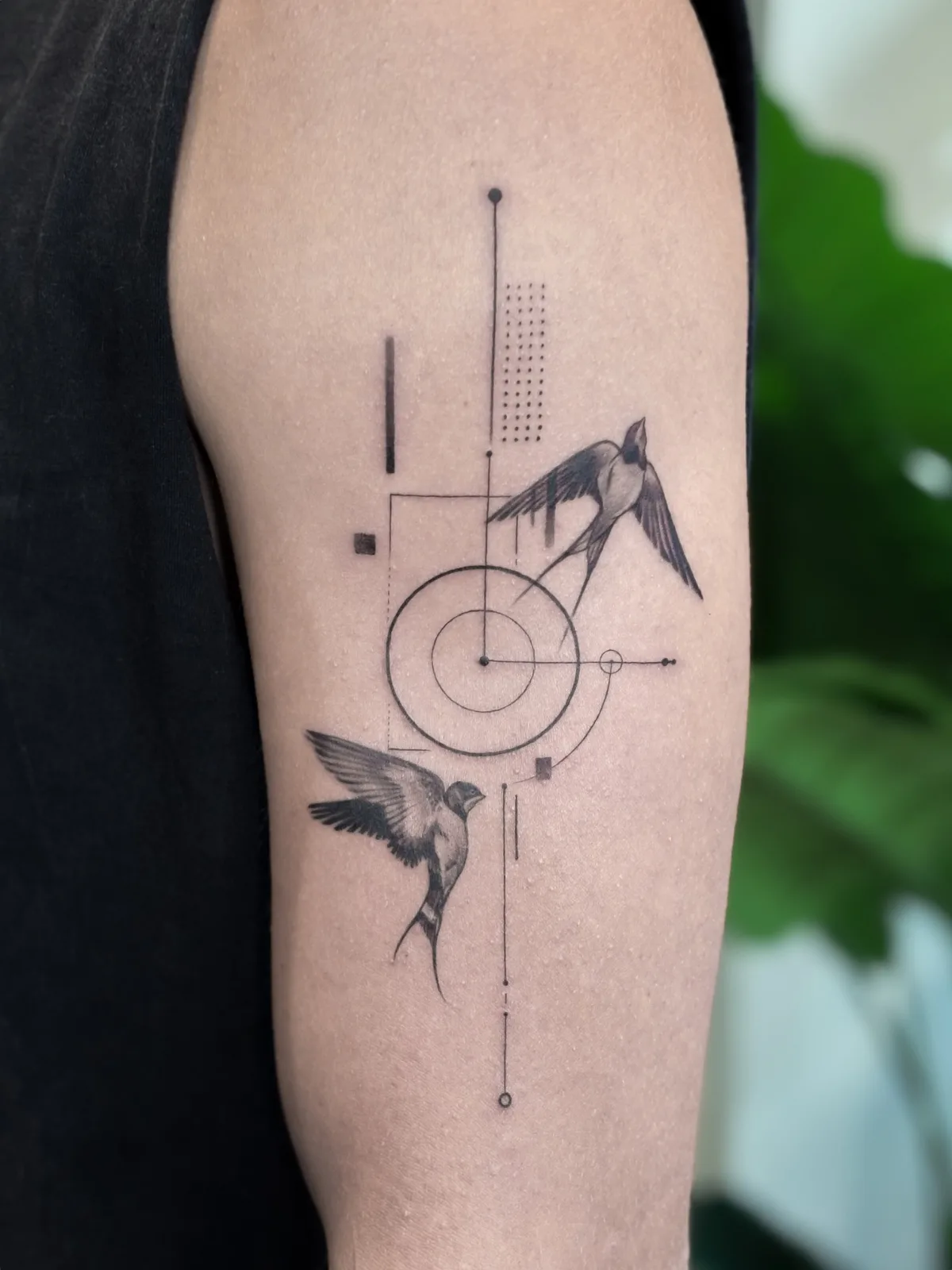 Fine line abstract tattoo on the arm