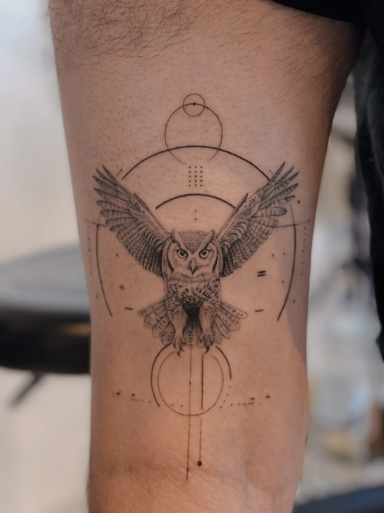Fine line abstract tattoo on the arm