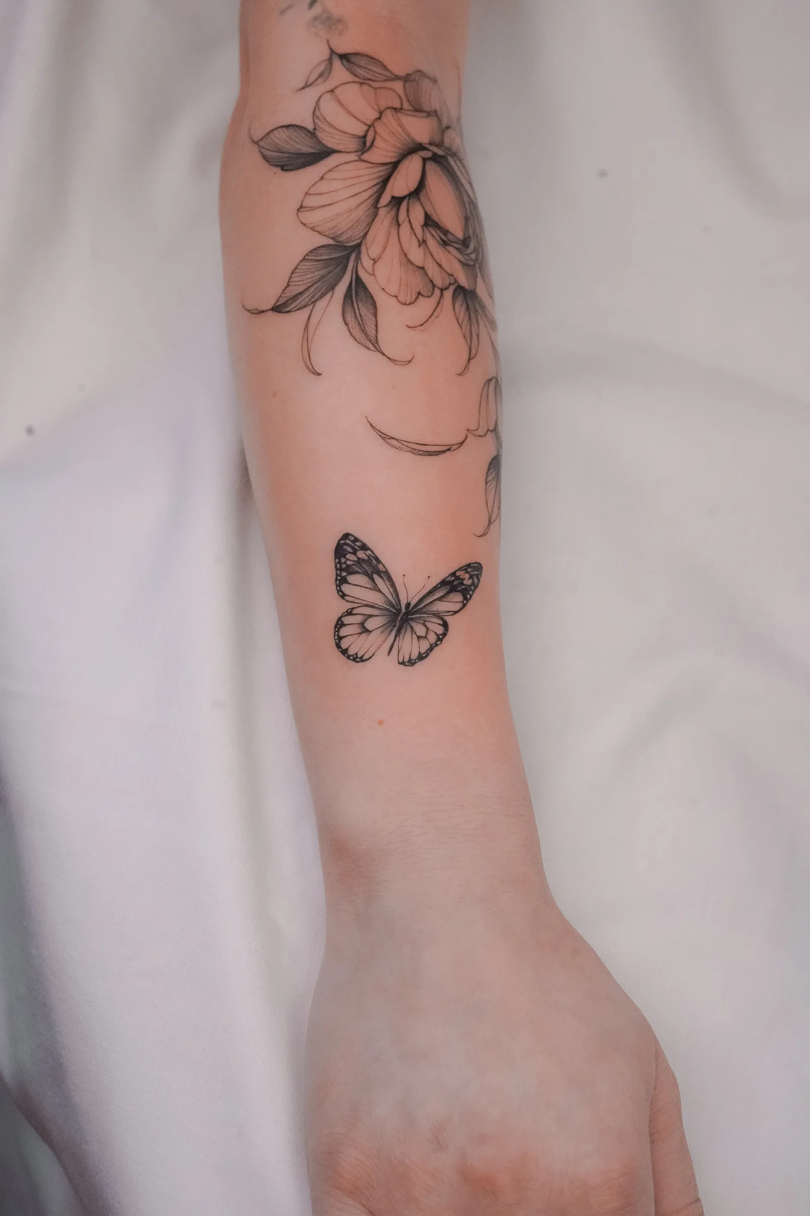 Fine line tattoo on the arm