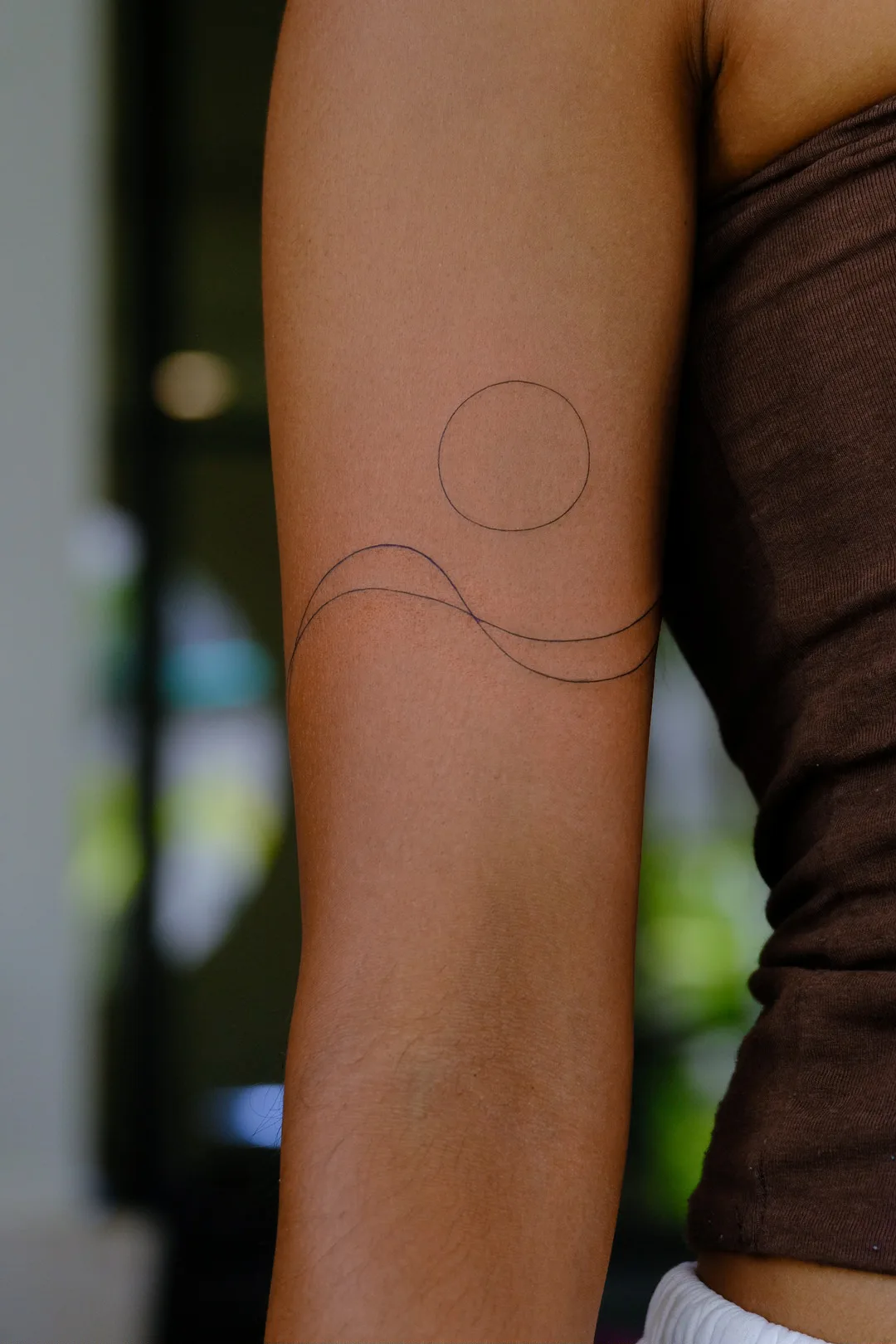 Fine line tattoo on the arm