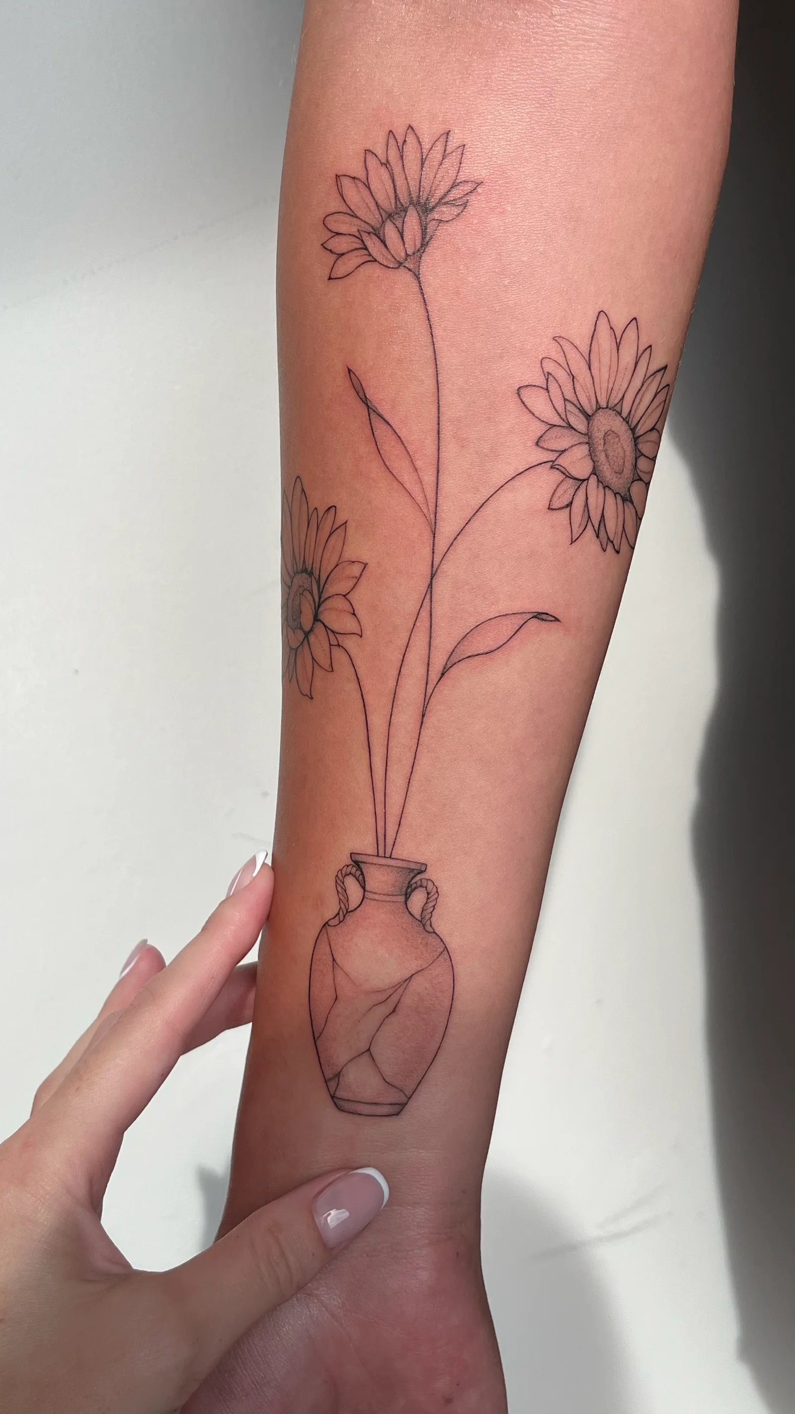 Fine line tattoo on the arm
