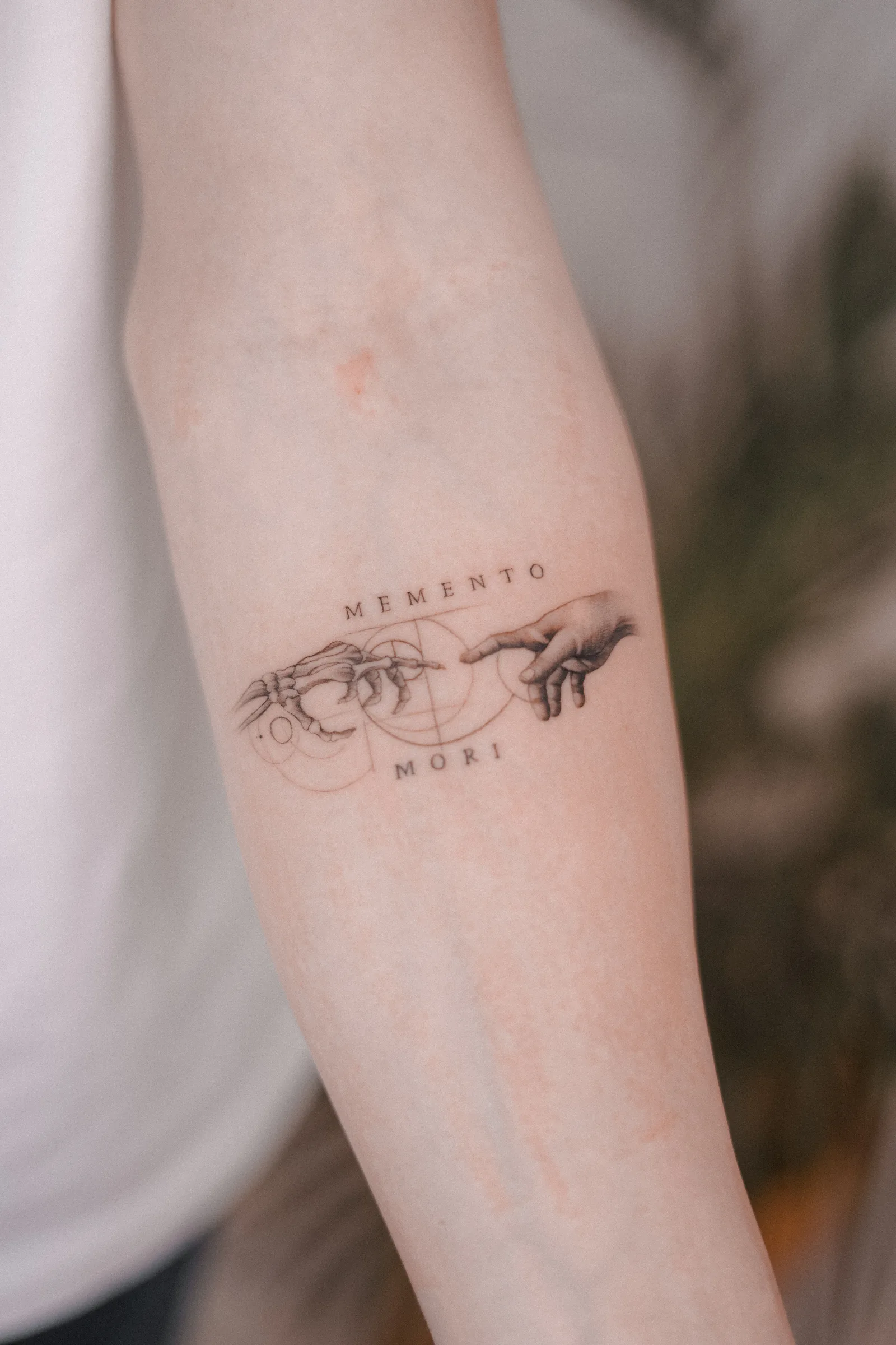 Fine line tattoo on the arm
