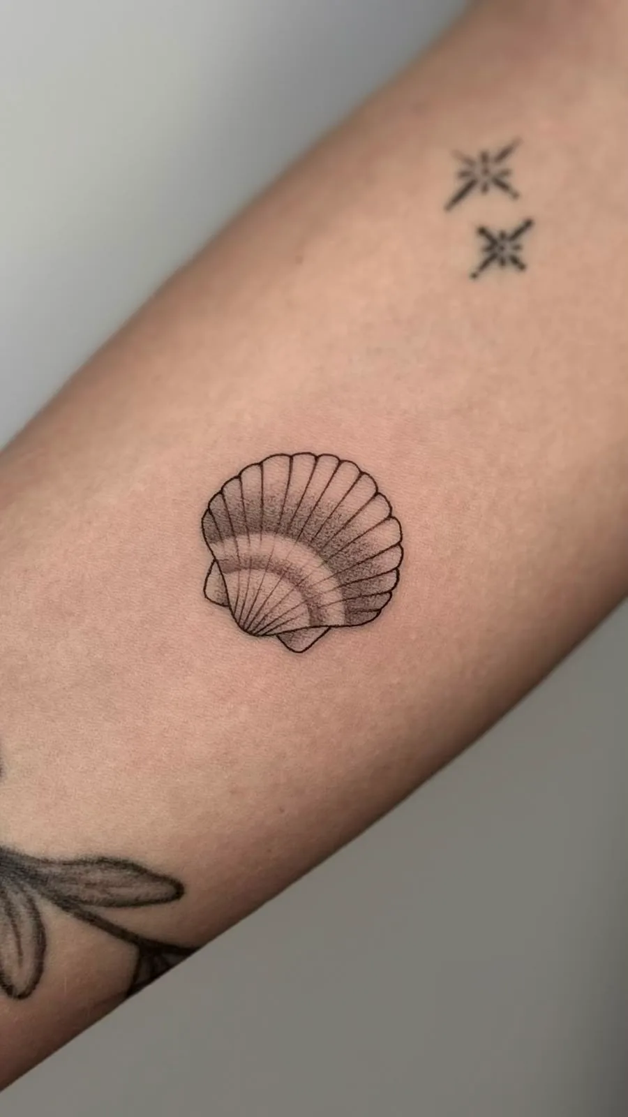Fine line tattoo on the arm