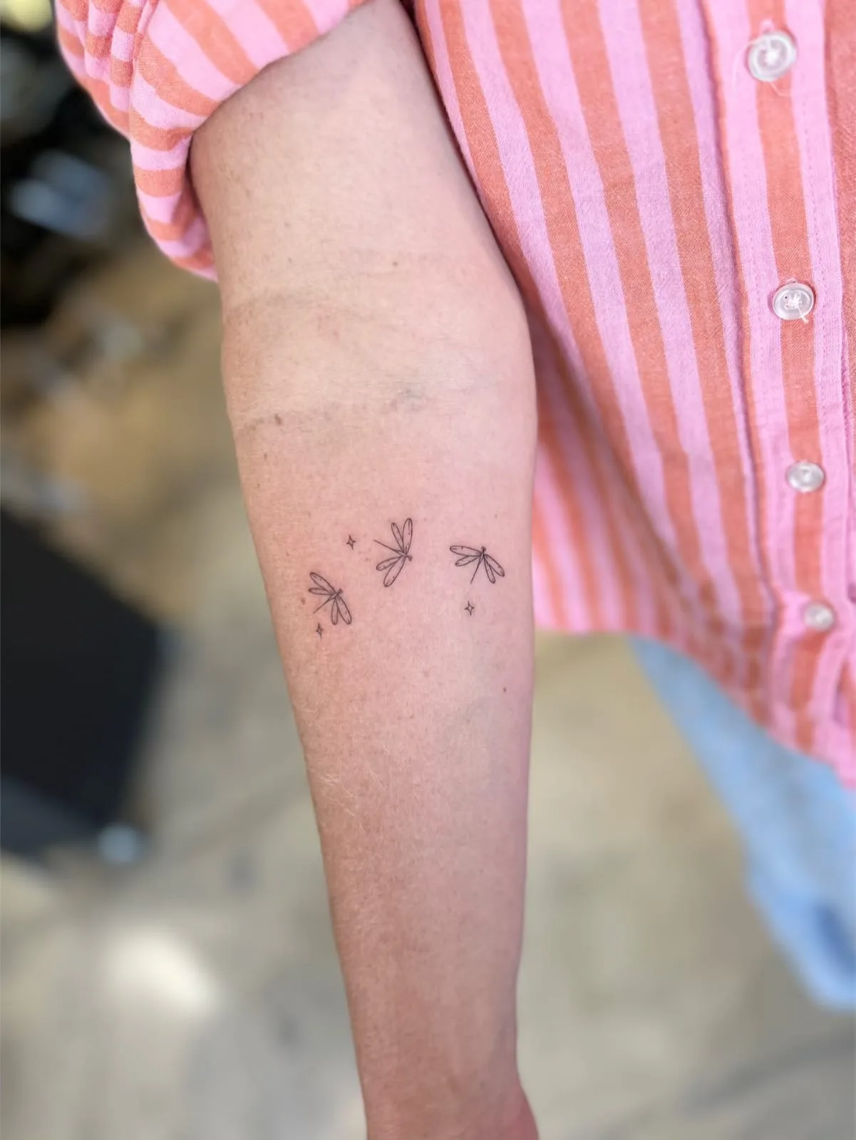 Fine line tattoo on the arm