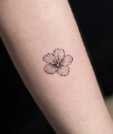 Hibiscus forearm tattoo