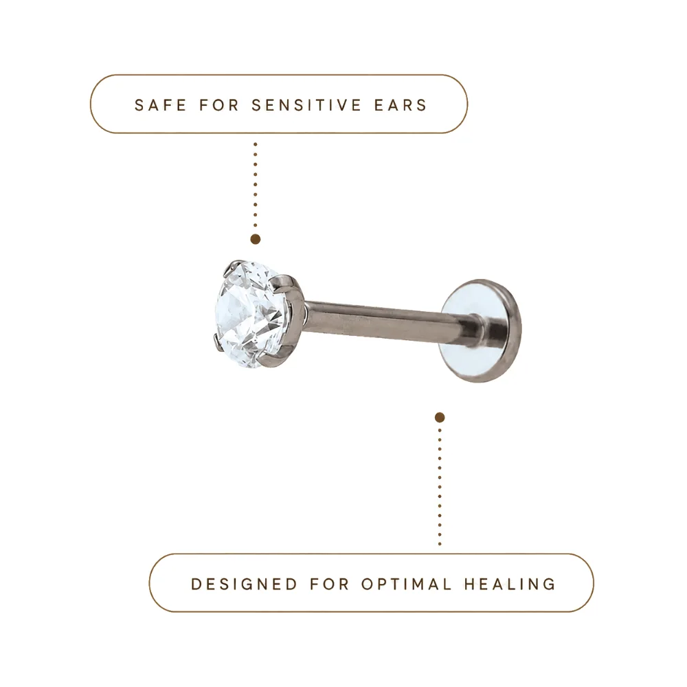 Implant-grade titanium flat-back labret with a prong-set stone, safe for sensitive ears, designed for optimal healing