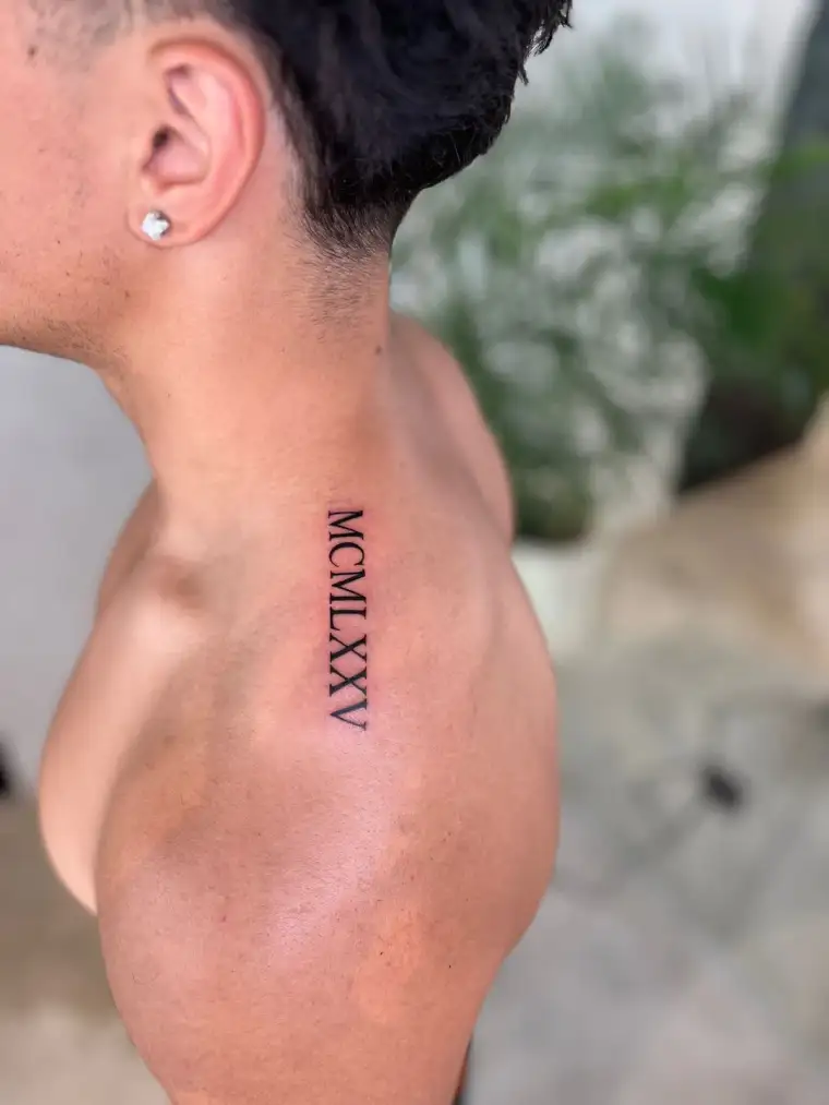 Fine line lettering shoulder tattoo
