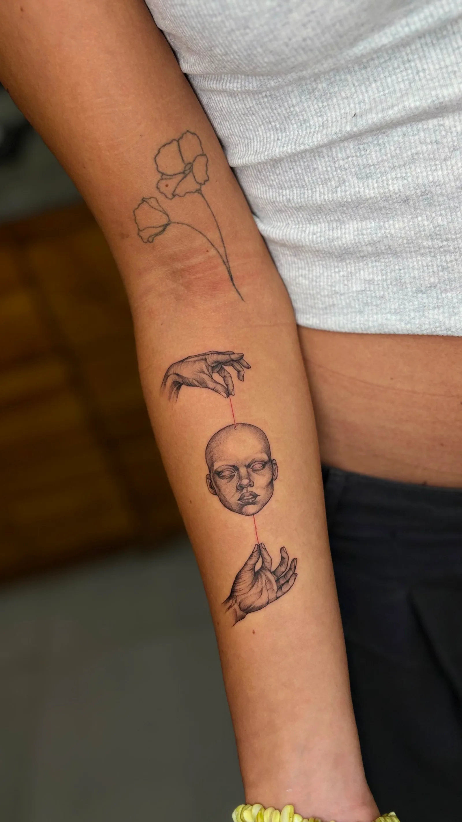 Micro-realism abstract tattoo on the arm