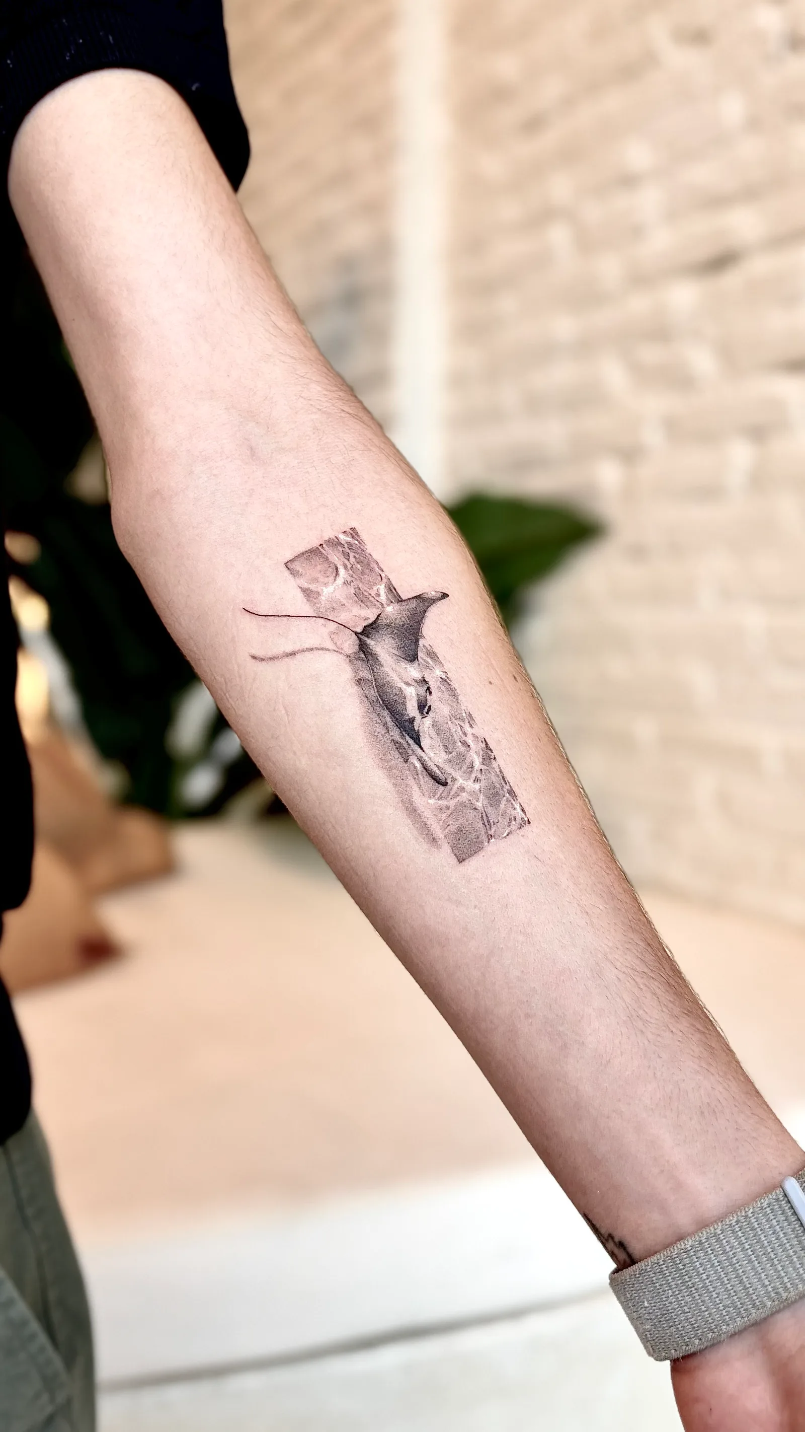 Micro-realism tattoo on the arm
