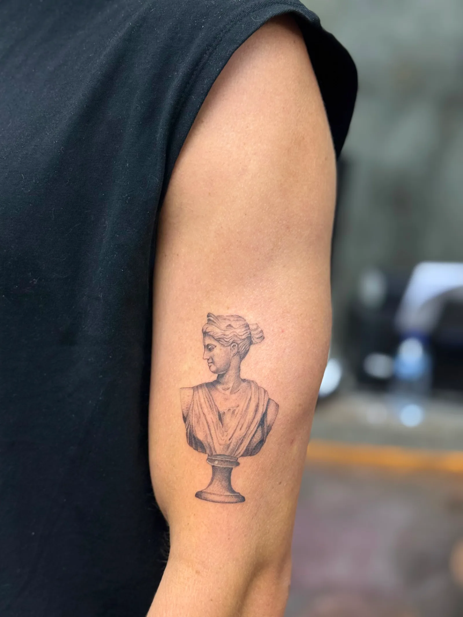 Micro-realism portrait tattoo on the arm