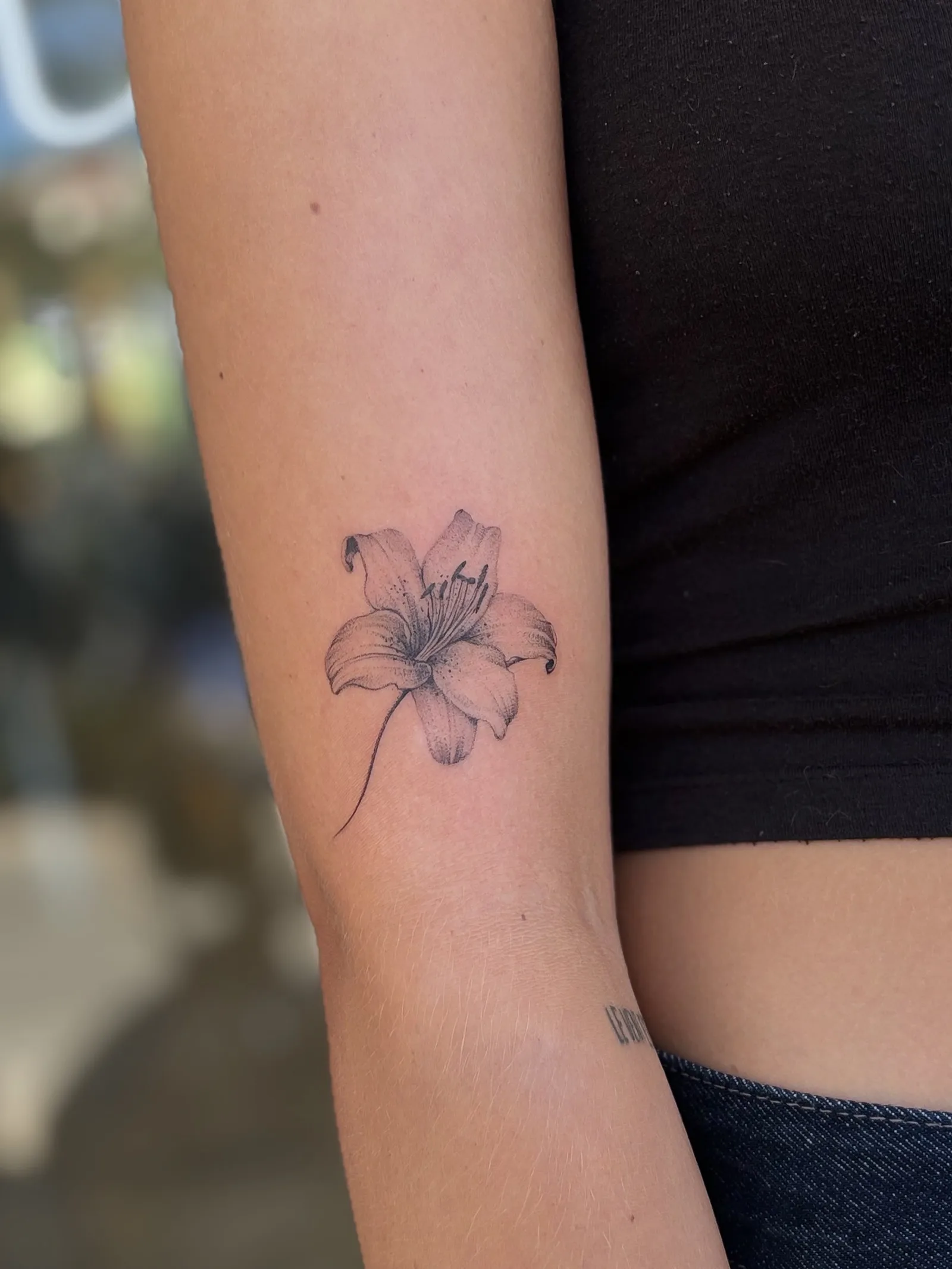 Micro-realism portrait tattoo on the arm
