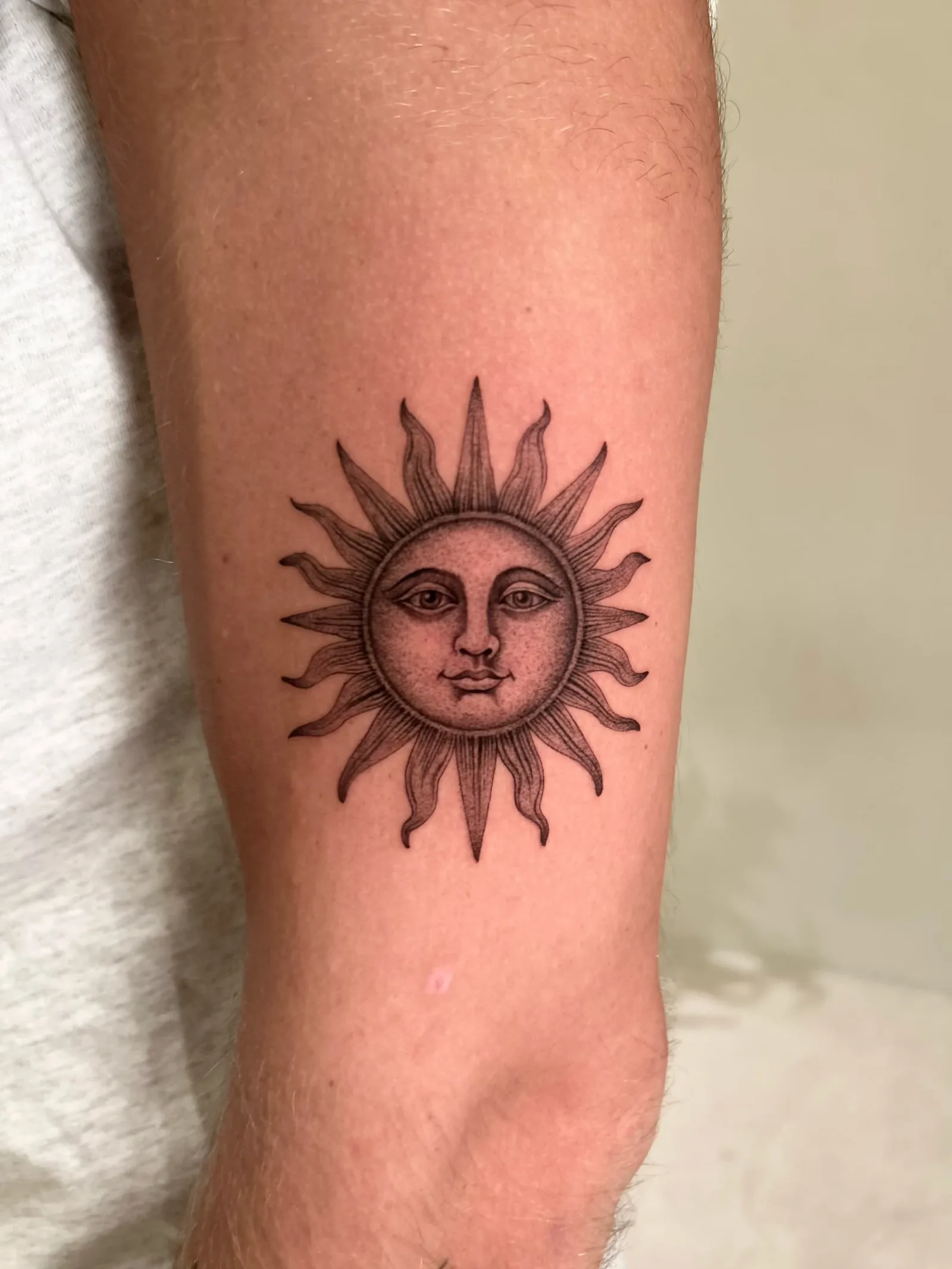 Micro-realism portrait tattoo on the arm