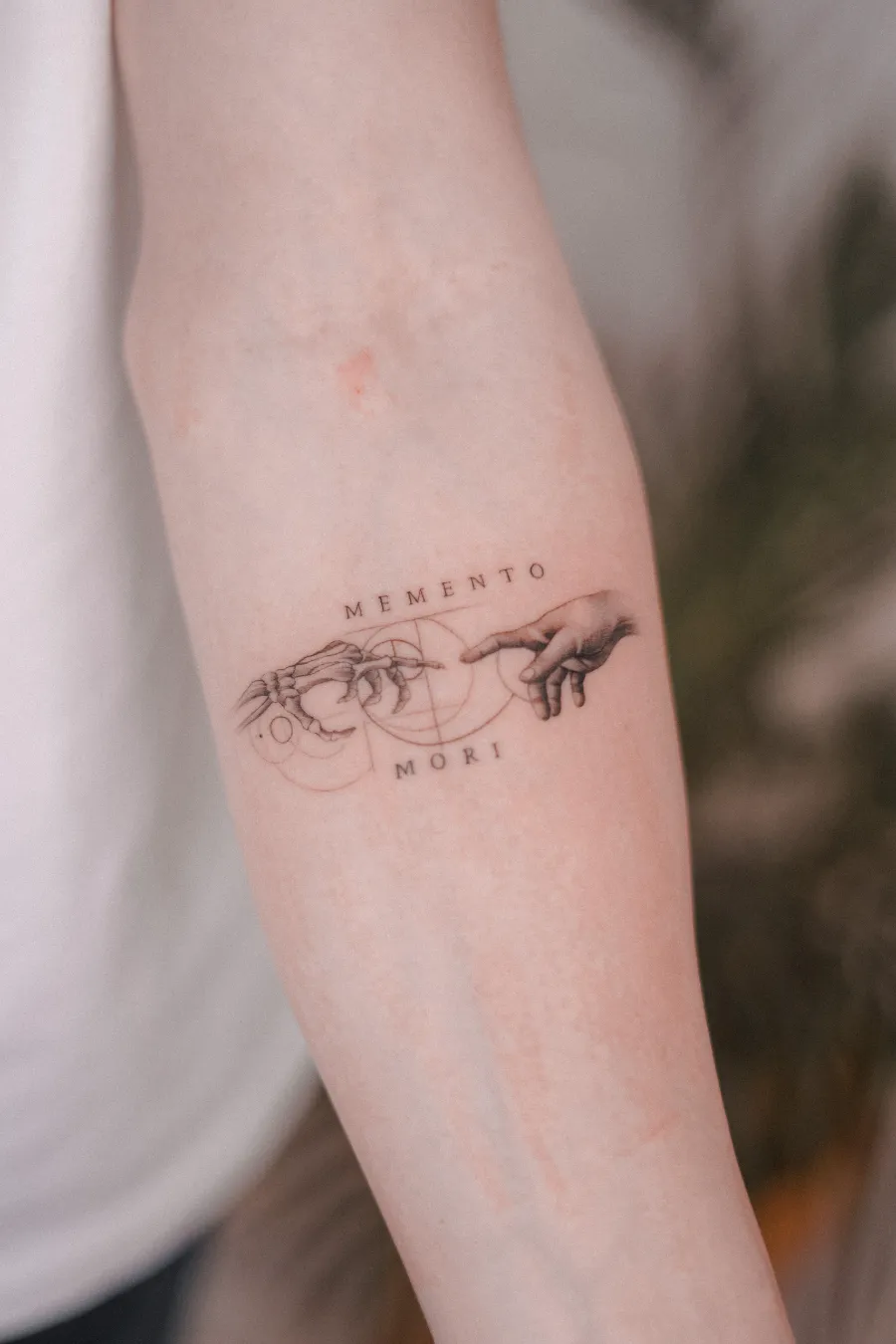 Micro-realism memento mori forearm tattoo