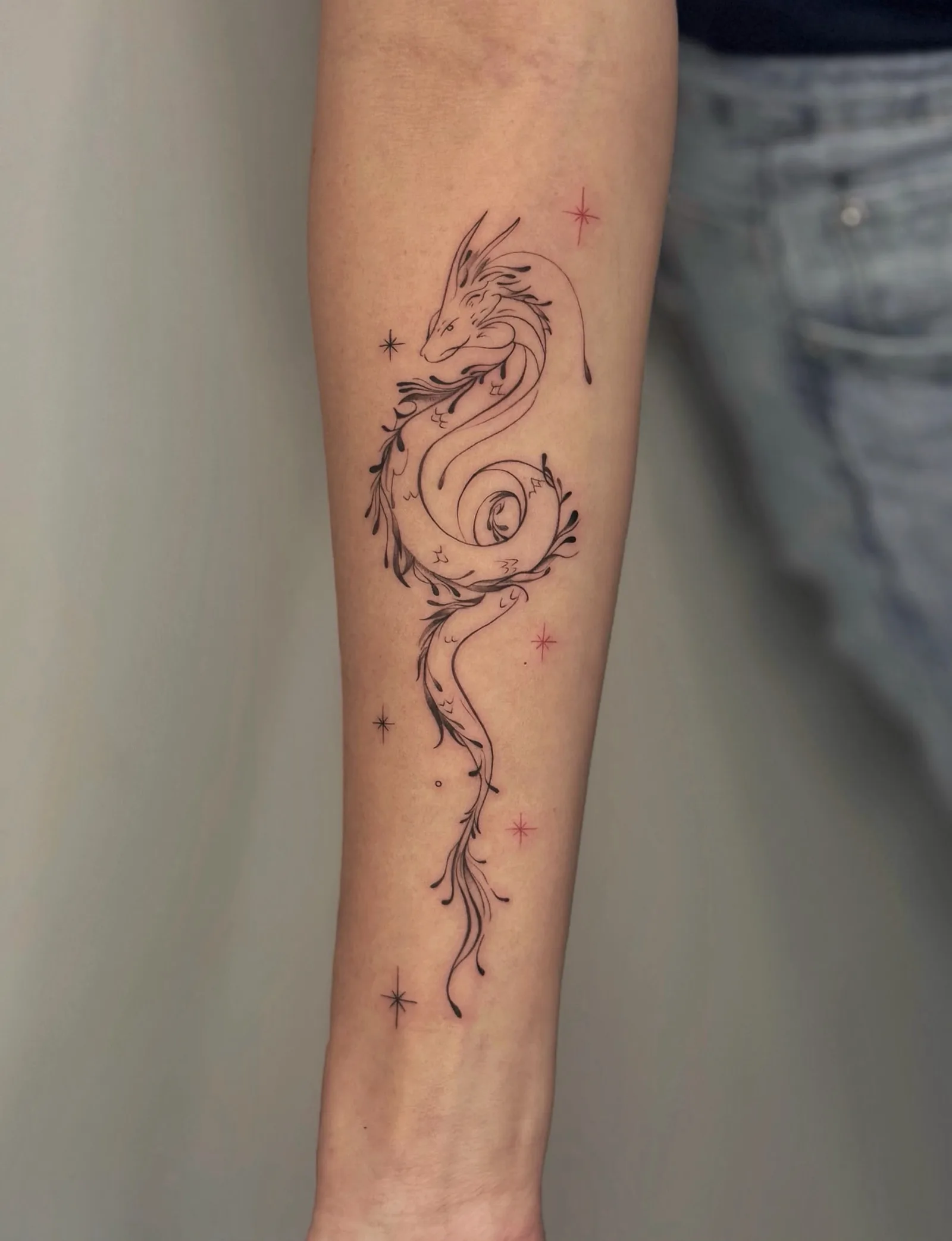 Blackwork & geometric ornamental tattoo on the arm