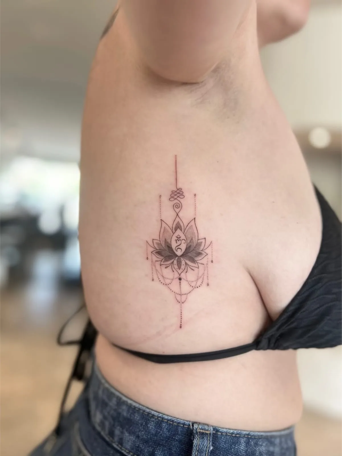 Blackwork & geometric ornamental tattoo on the arm
