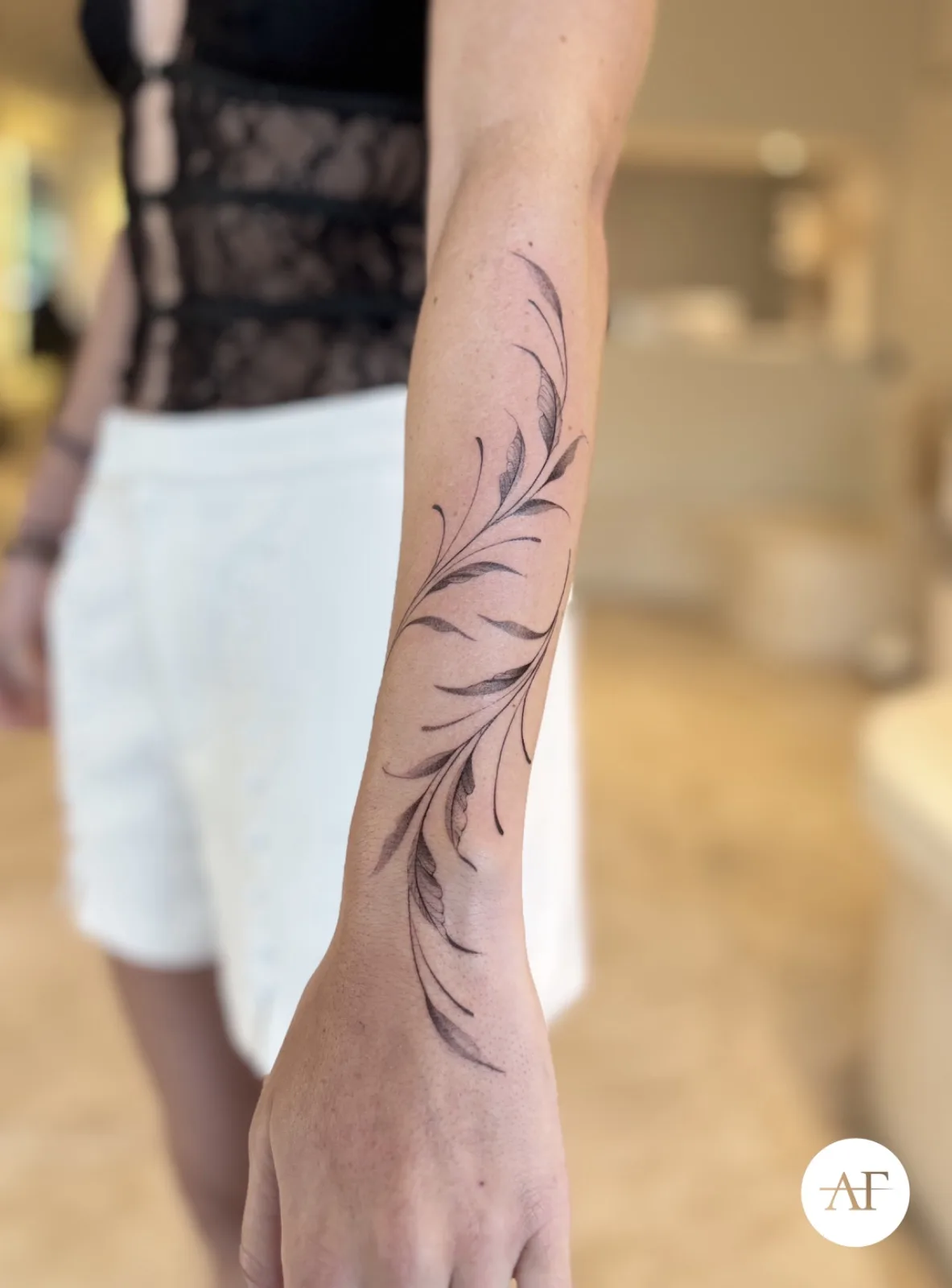 Blackwork & geometric ornamental tattoo on the arm