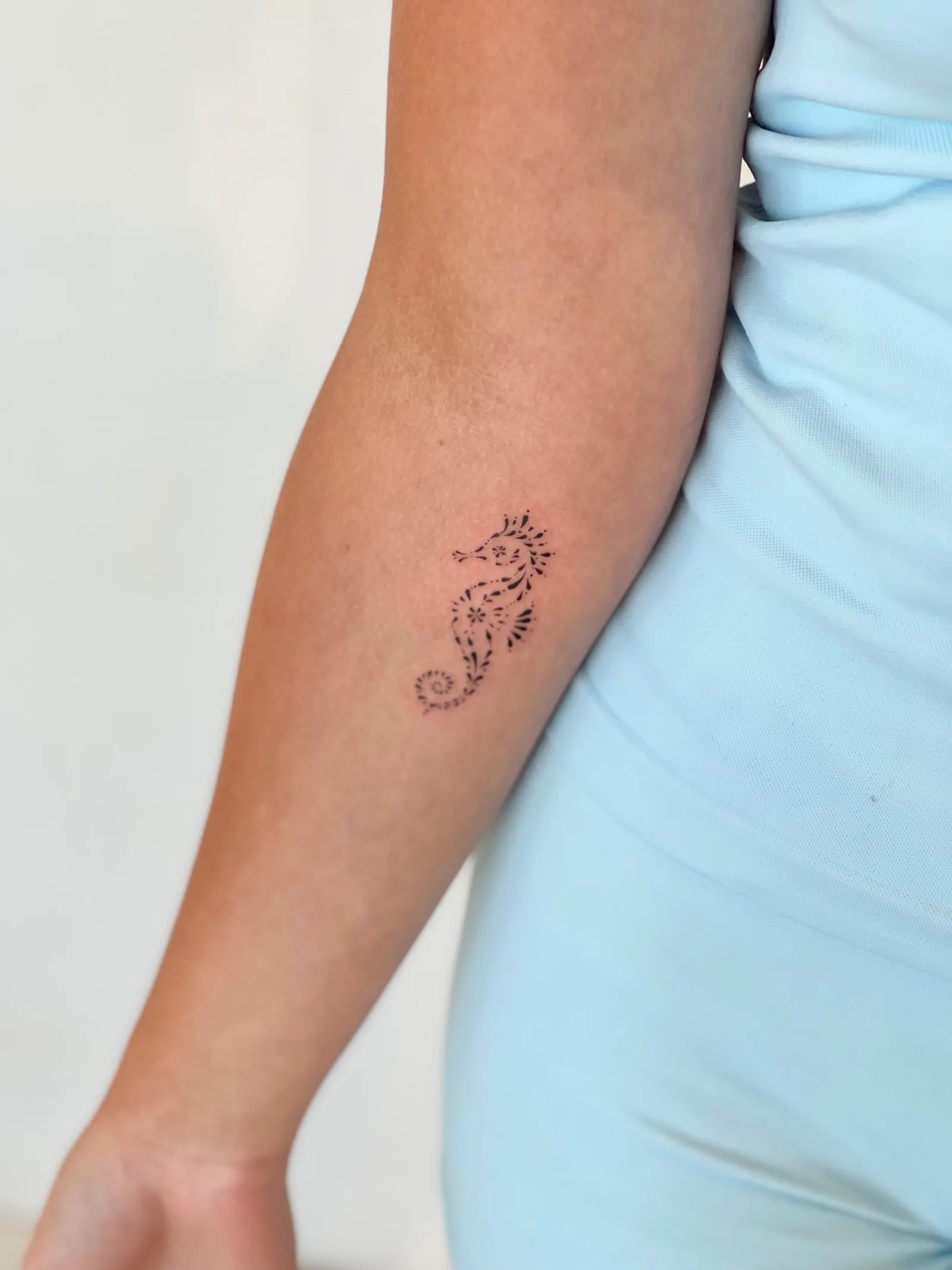 Blackwork & geometric ornamental tattoo on the arm