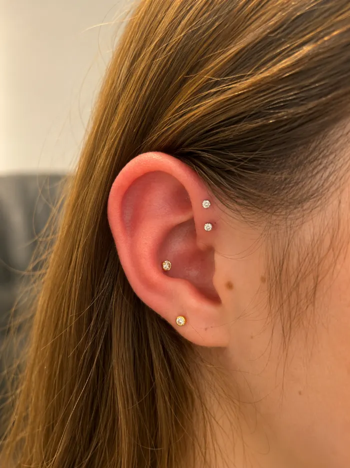 Conch piercing with curated ear stack