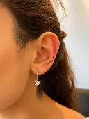 Conch piercing with a fine gold ring