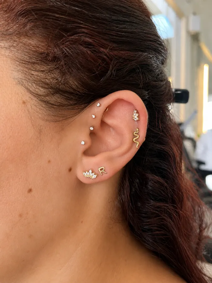 Forward helix piercing on a client
