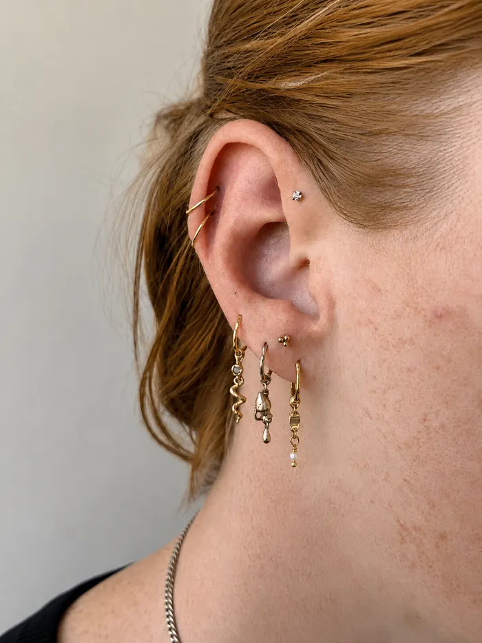 Forward helix piercing on a client